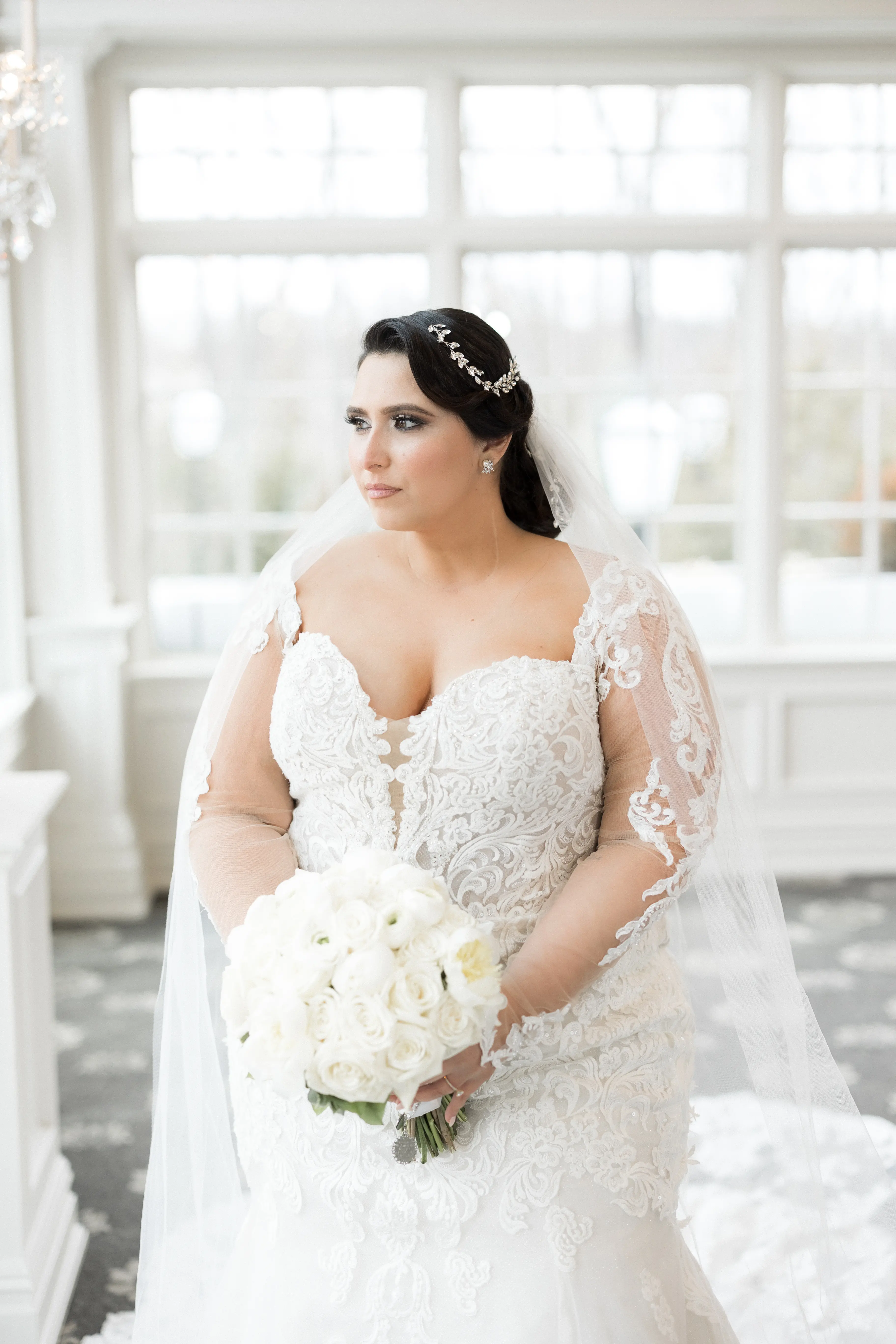 Bride Wearing Sexy Lace Long Sleeve Wedding Dress Called Fiona By Maggie Sottero Looking Out A Window