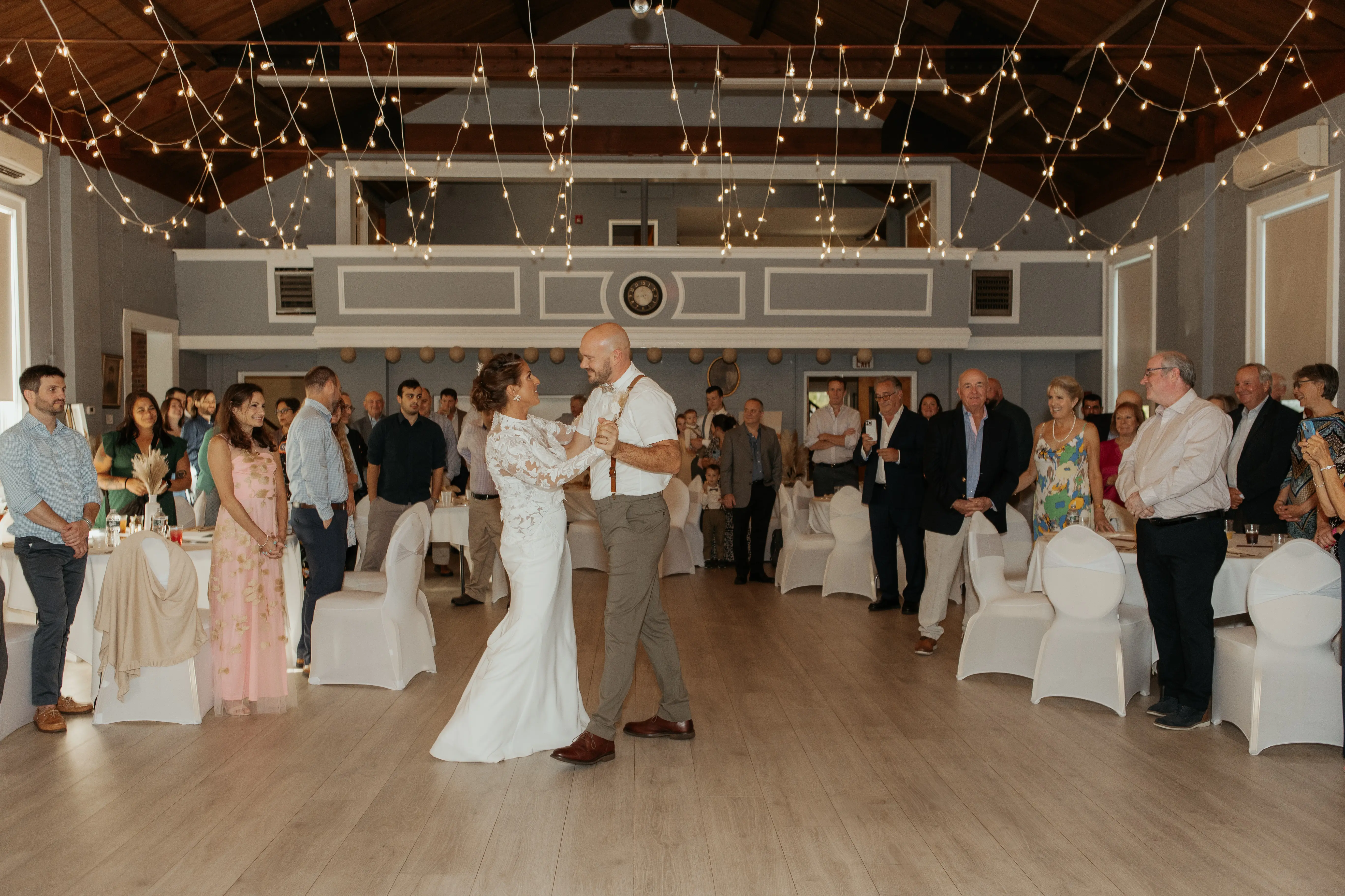 Bride Wearing Crepe Wedding Dress Called Dionne By Rebecca Ingram Dancing With Groom At The Reception