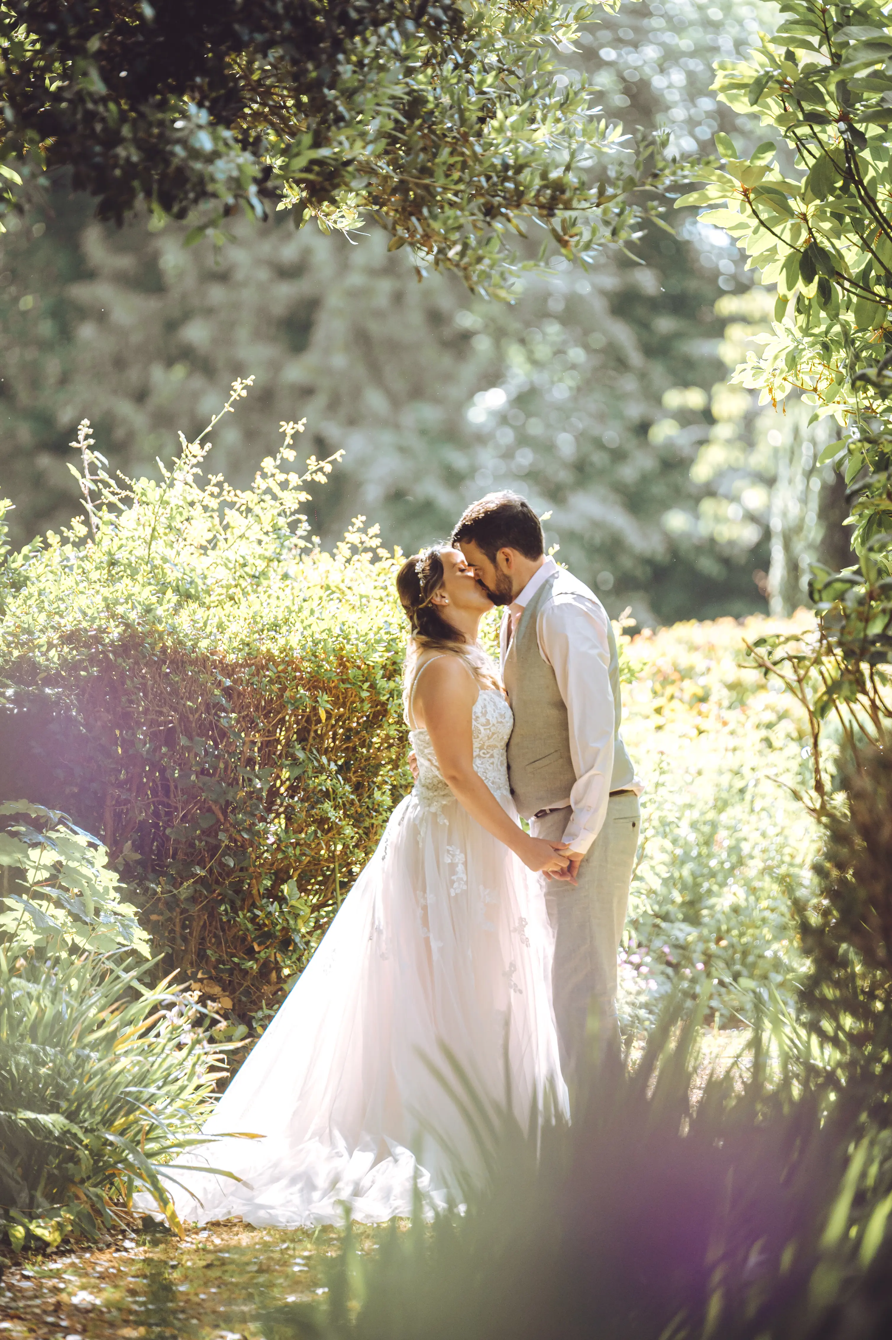 Groom With Bride Wearing A-Line Spaghetti Strap Wedding Dress Marisol By Rebecca Ingram