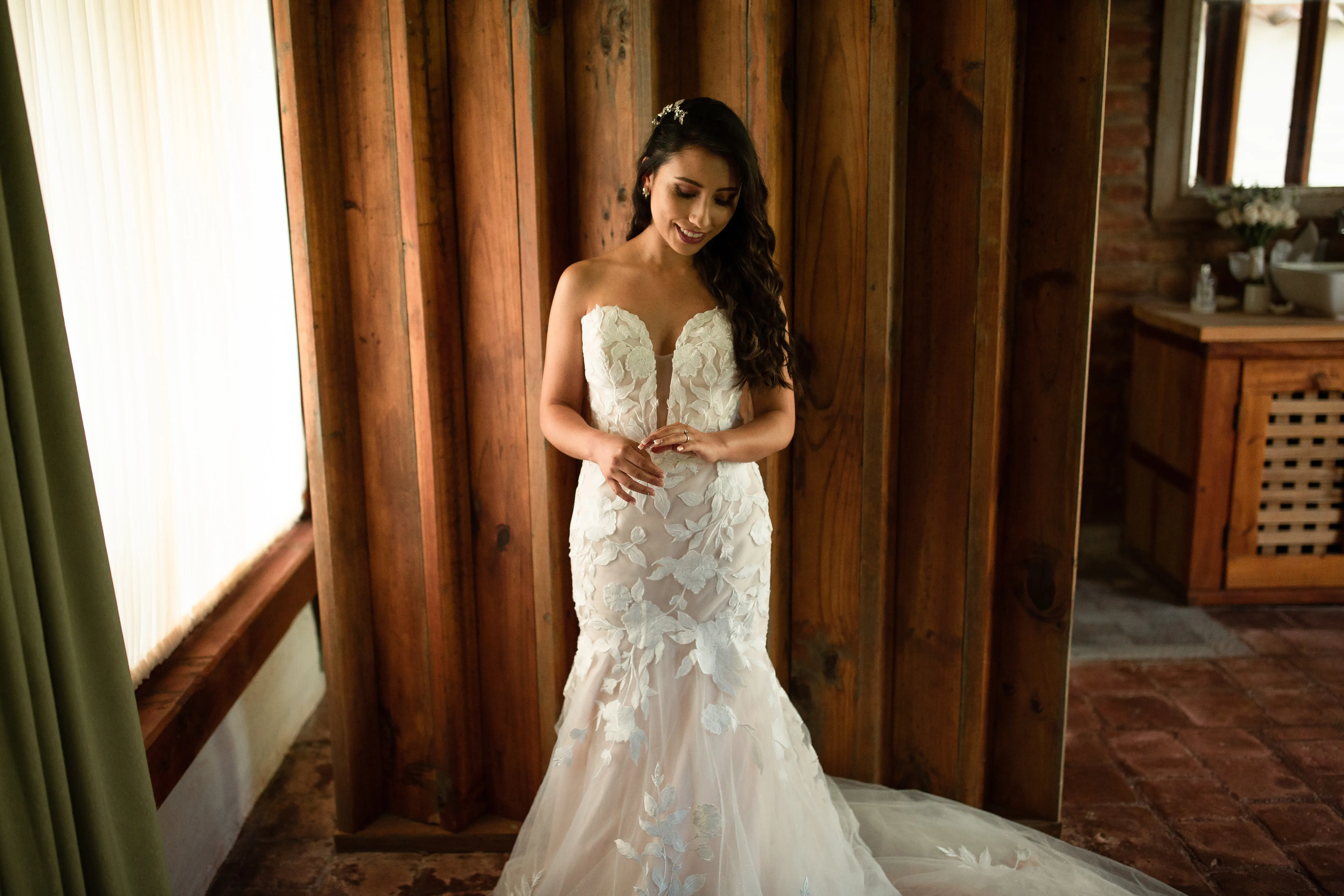 Bride wearing affordable, strapless mermaid wedding dress.