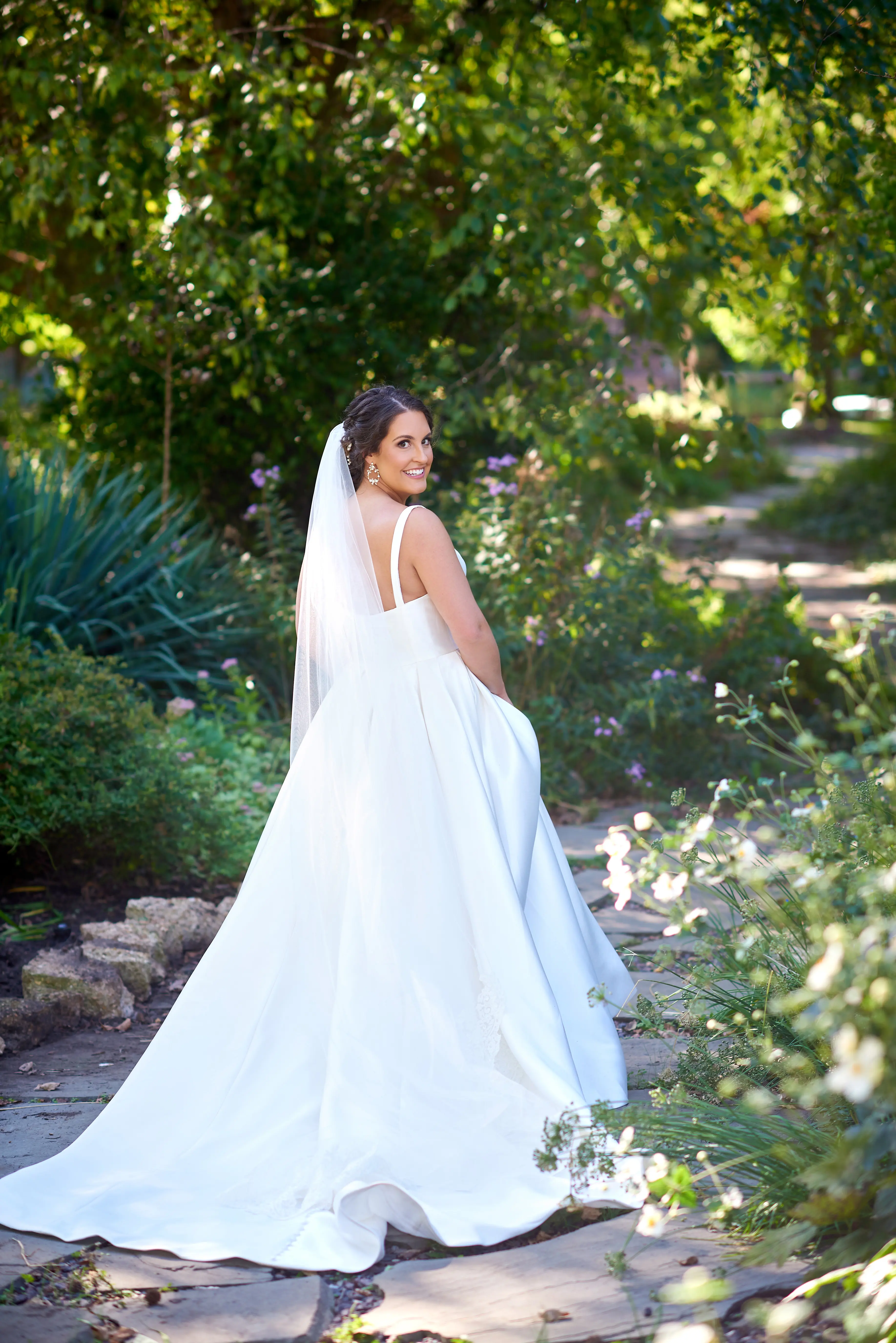 Bride Wearing Classic A-Line Bridal Gown Called Selena By Maggie Sottero In A Garden
