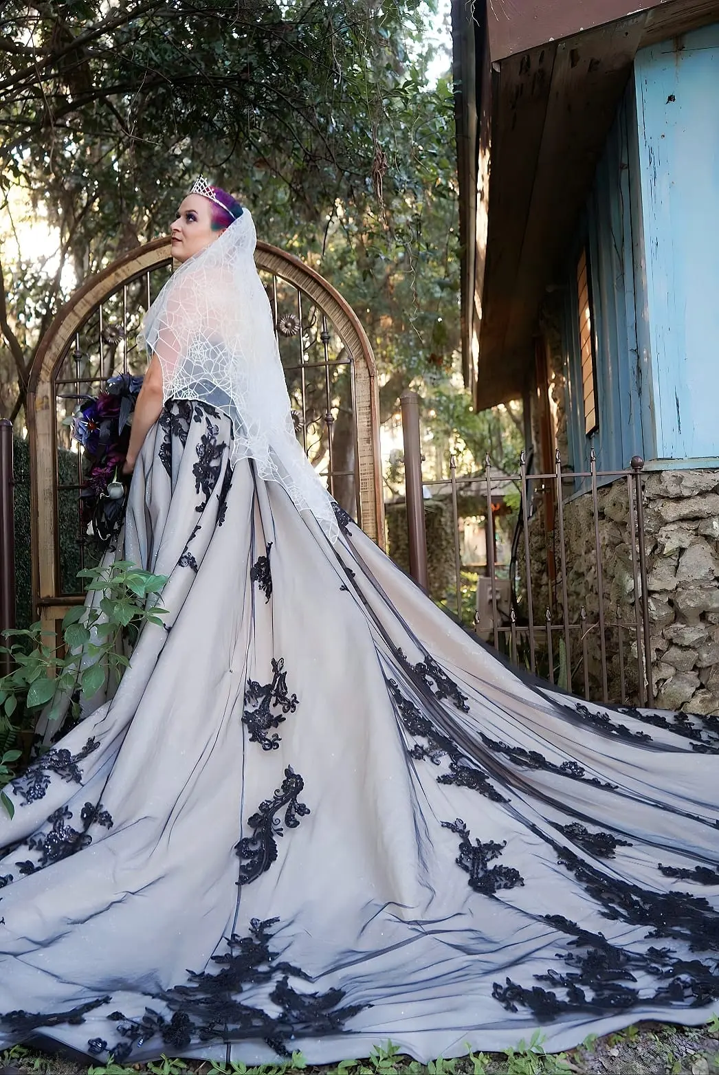 Bride Wearing Black Lace Wedding Dress Called Norvinia By Sottero and Midgley With Spiderweb Veil