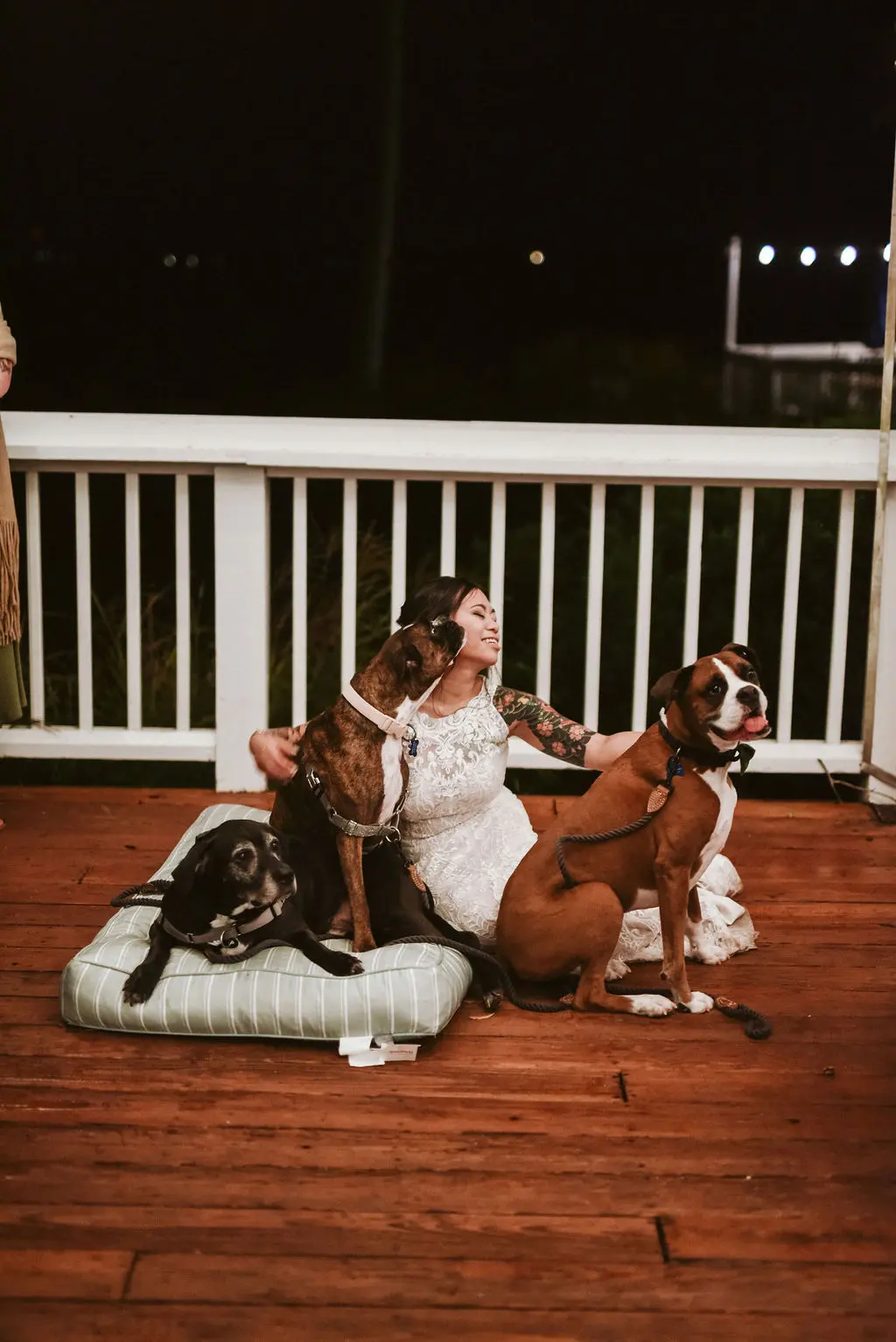 Bride Wearing Halter Lace Wedding Dress Called Kevyn By Sottero And Midgley Sitting With Her Dogs