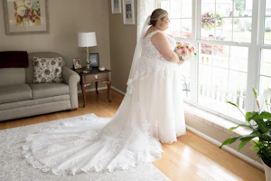 Bride wearing Lace A-line Wedding Dress called Trinity Lynette by Maggie Sottero