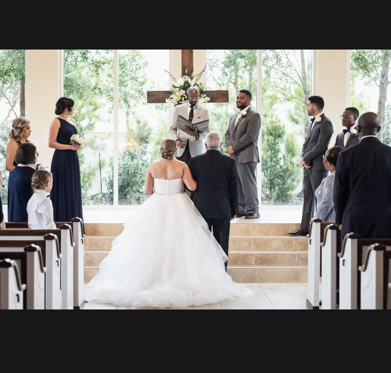 Real Bride in Strapless Tiered Wedding Dress Named Yasmin by Maggie Sottero Walking Down the Aisle