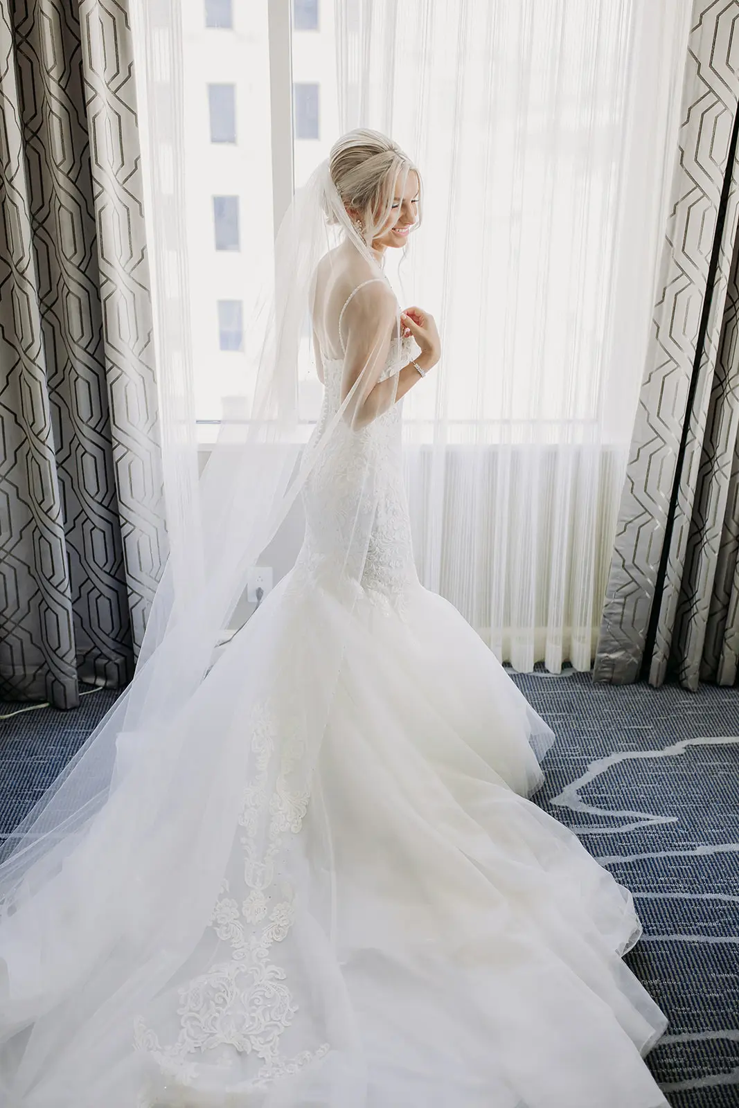 Bride wearing mermaid wedding dress called Alistaire.