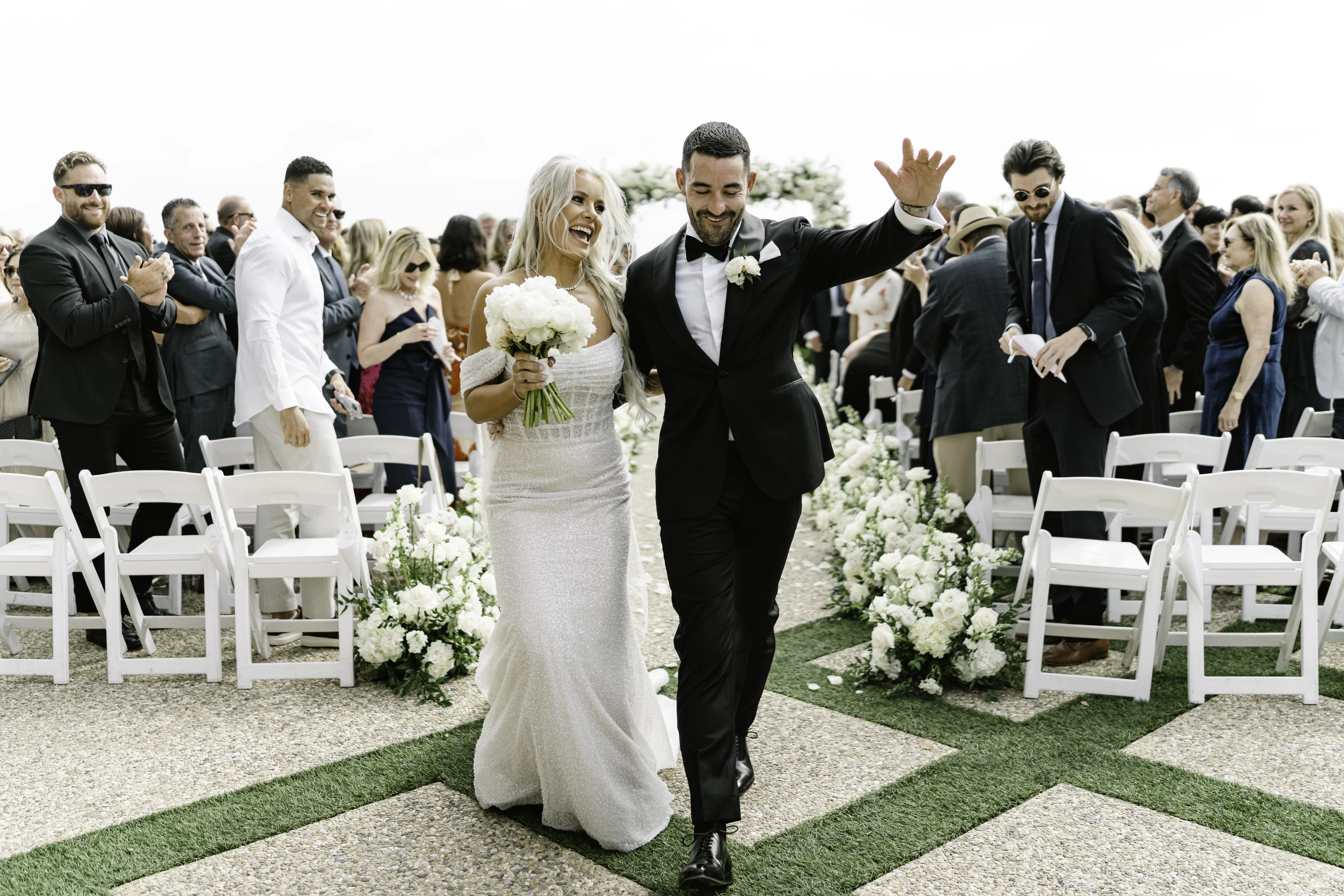 Bride Wearing Pearl Sparkly Bridal Gown Called Drew By Maggie SotteroWalking Down The Aisle With Groom