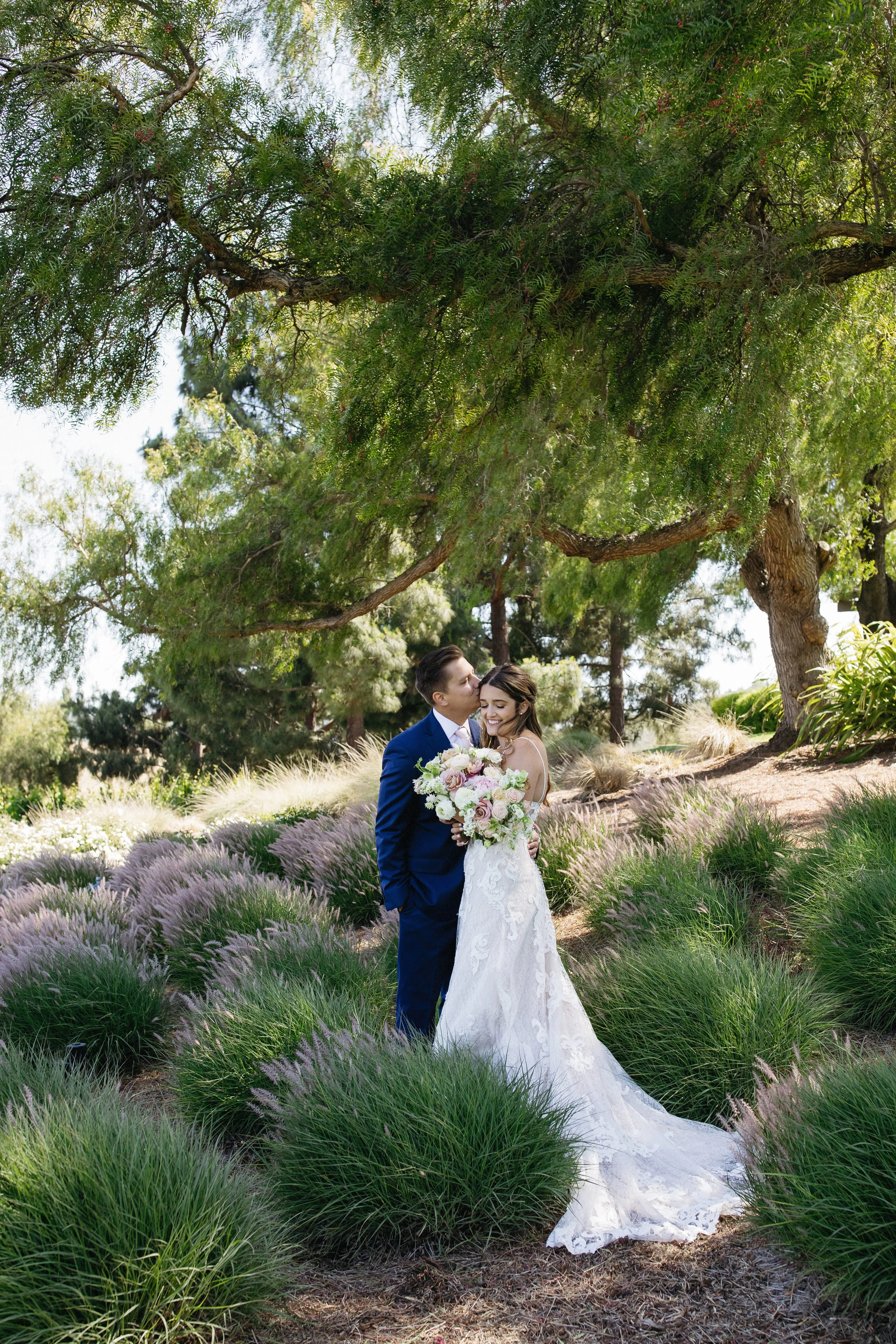 Bride with groom wearing romantic, A-line wedding dress
