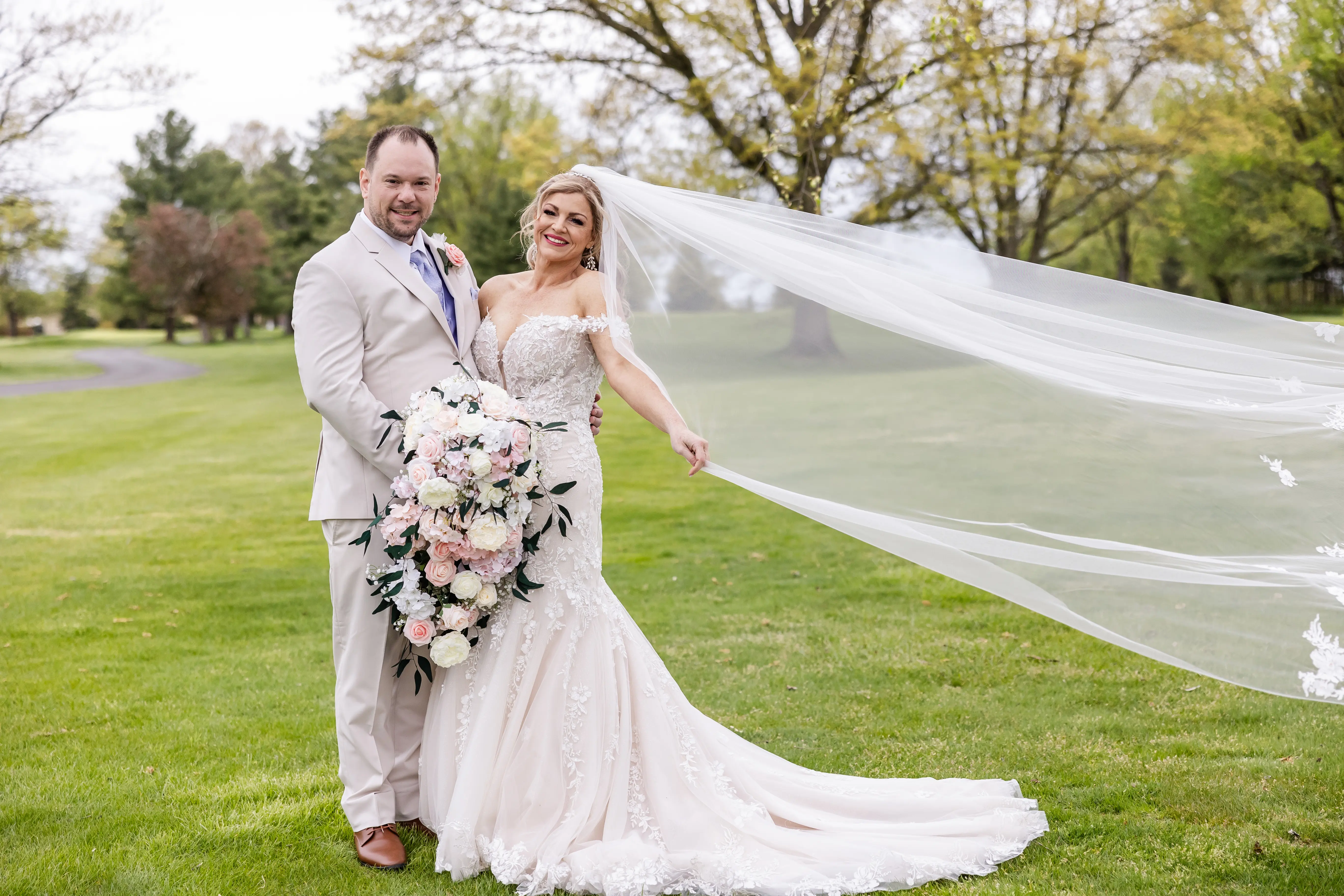 Bride wearing Lennon by Maggie Sottero with her husband