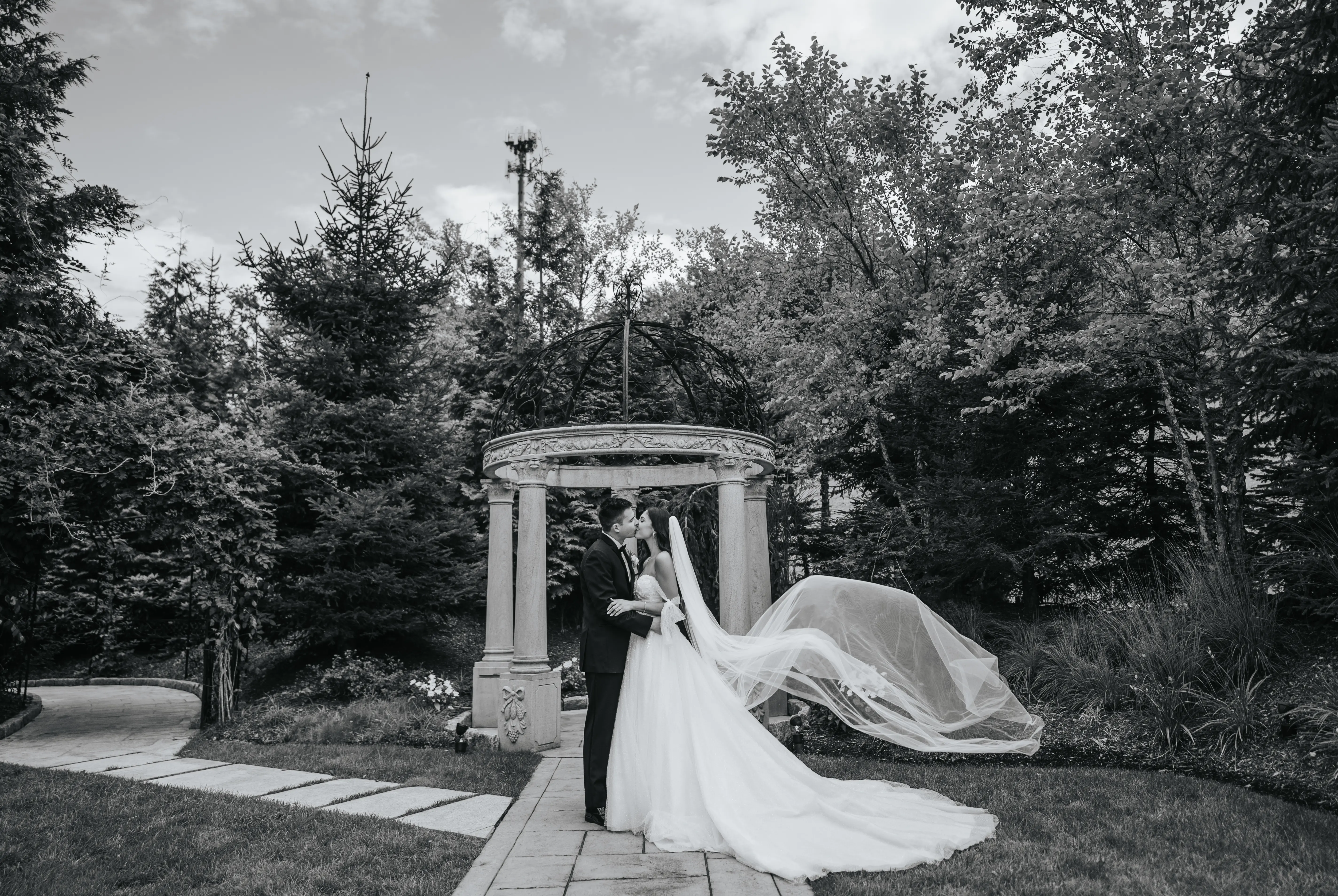 Bride Wearing Sparkly Ballgown Wedding Dress Called Shasta By Sottero And Midgley Kissing Groom