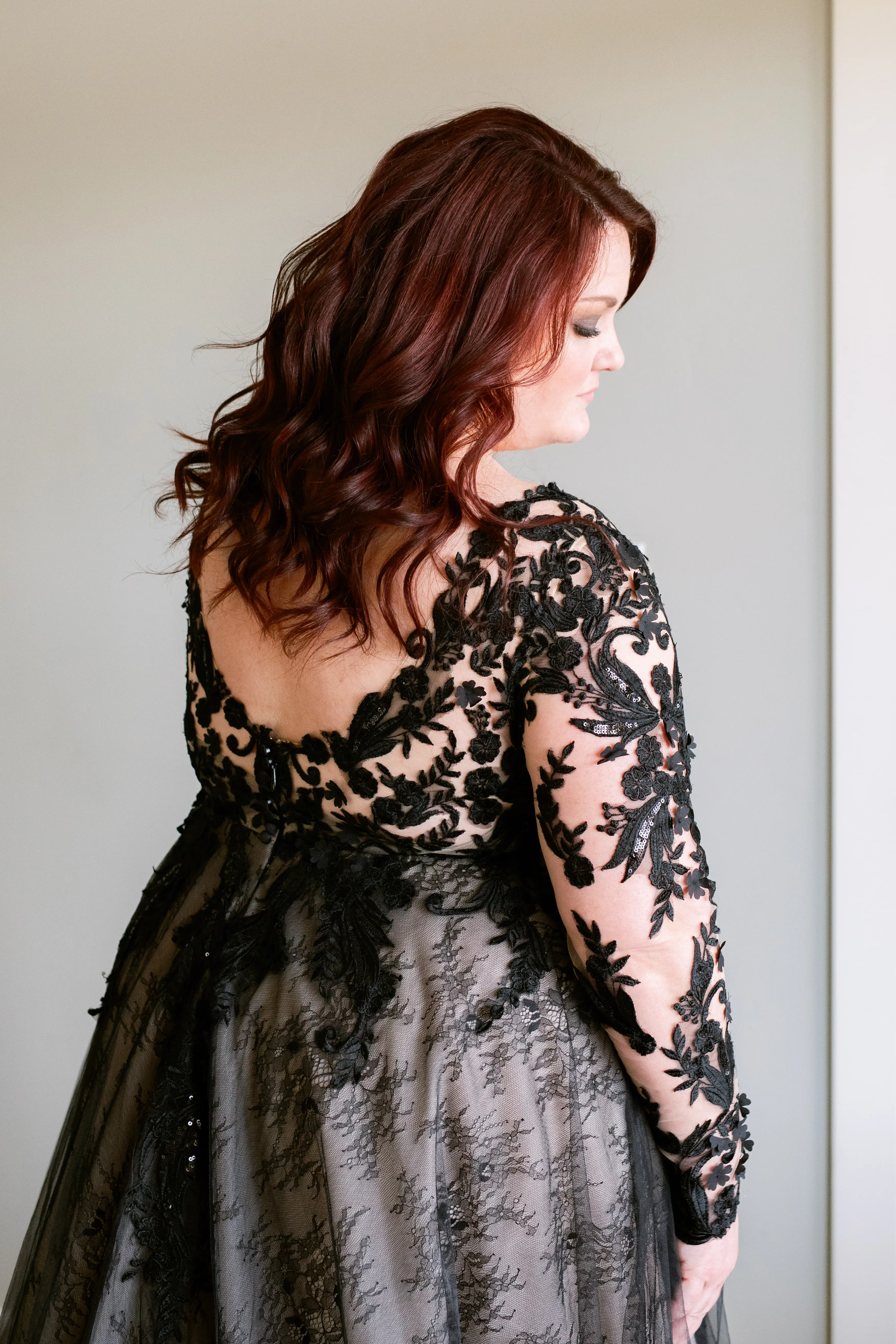 back of bride wearing black wedding dress called Zander.