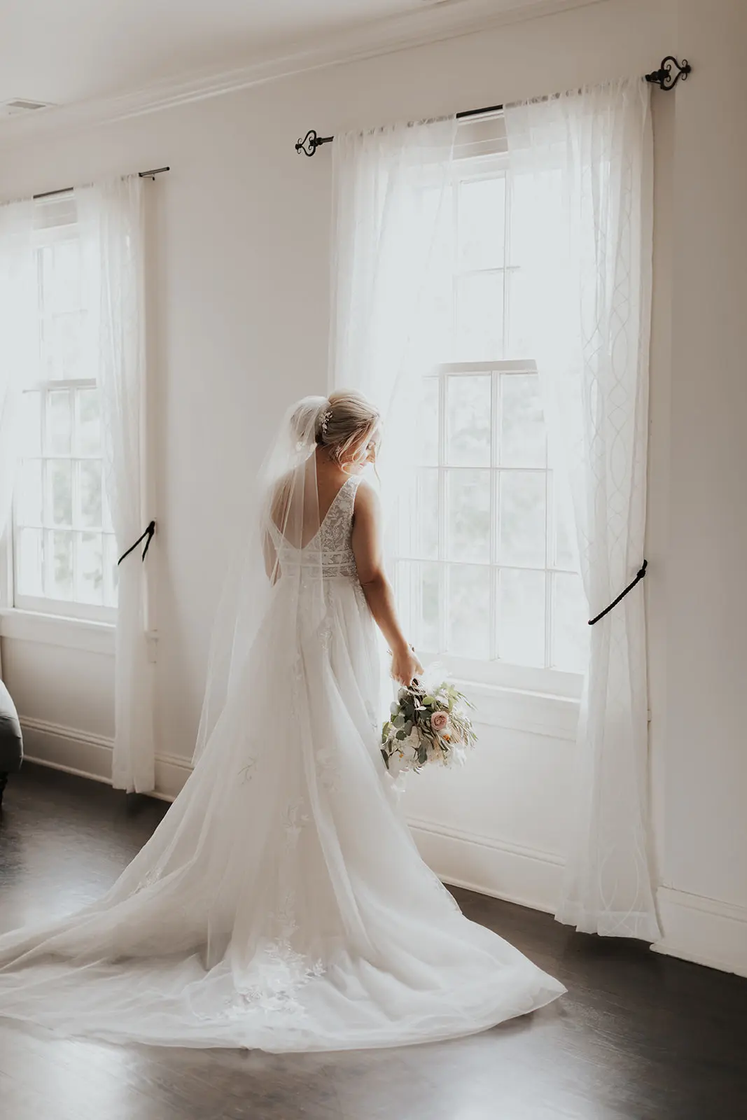 Bride In Lace Backless Wedding Dress Called Raelynn By Rebecca Ingram