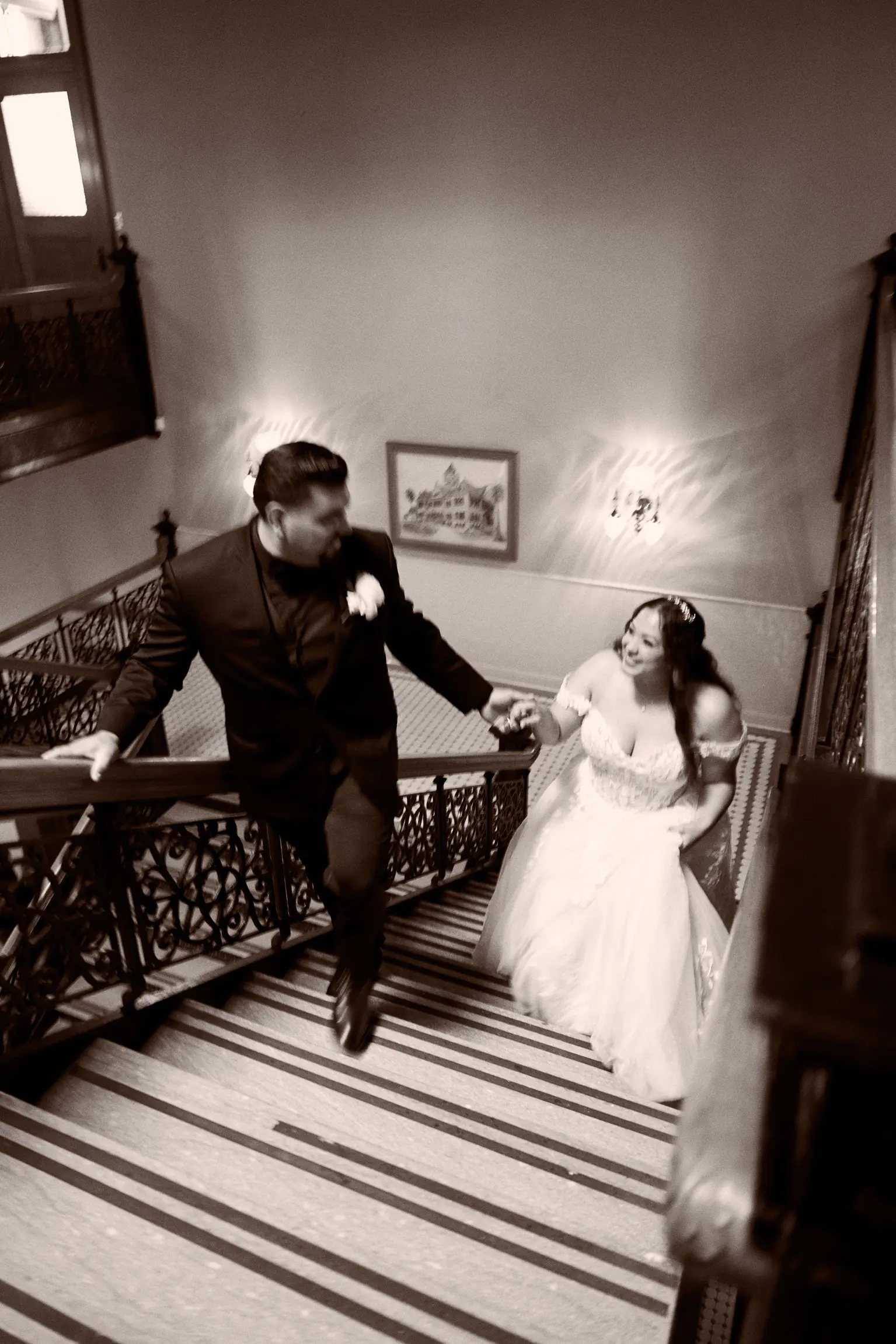 Bride Wearing Lace Ballgown Wedding Dress Called Harlem By Maggie Sottero Walking Upstairs With Groom