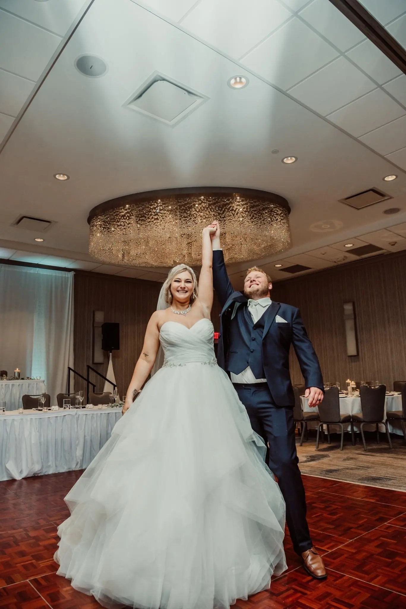 Bride in tulle princess dress called Yasmin by Maggie Sottero with groom