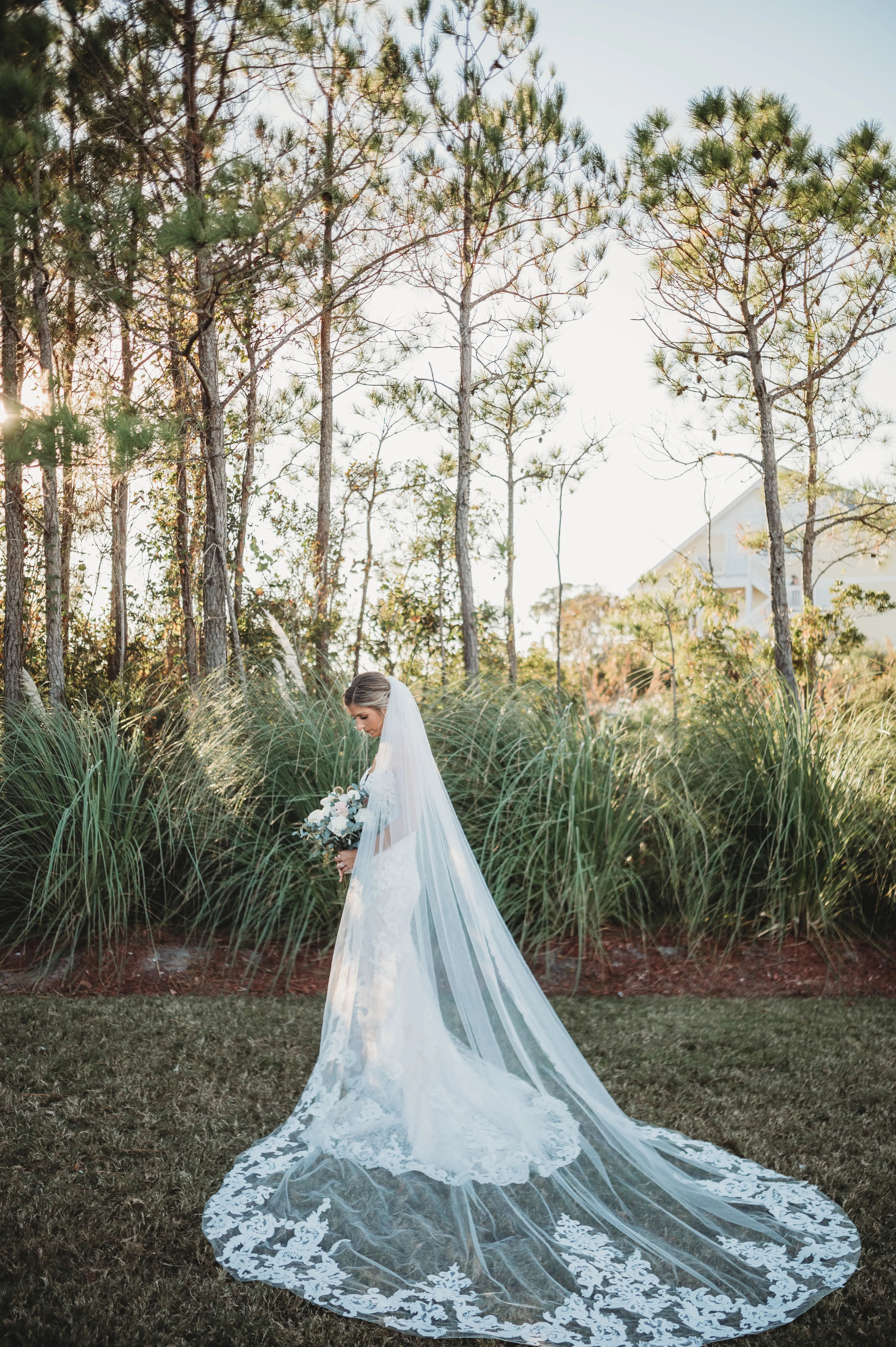 Bride in Mermaid Wedding Dress with Shimmering Lace Motifs and Illusion Plunging Sweetheart Neckline Called Tuscany by Maggie Sottero with Veil