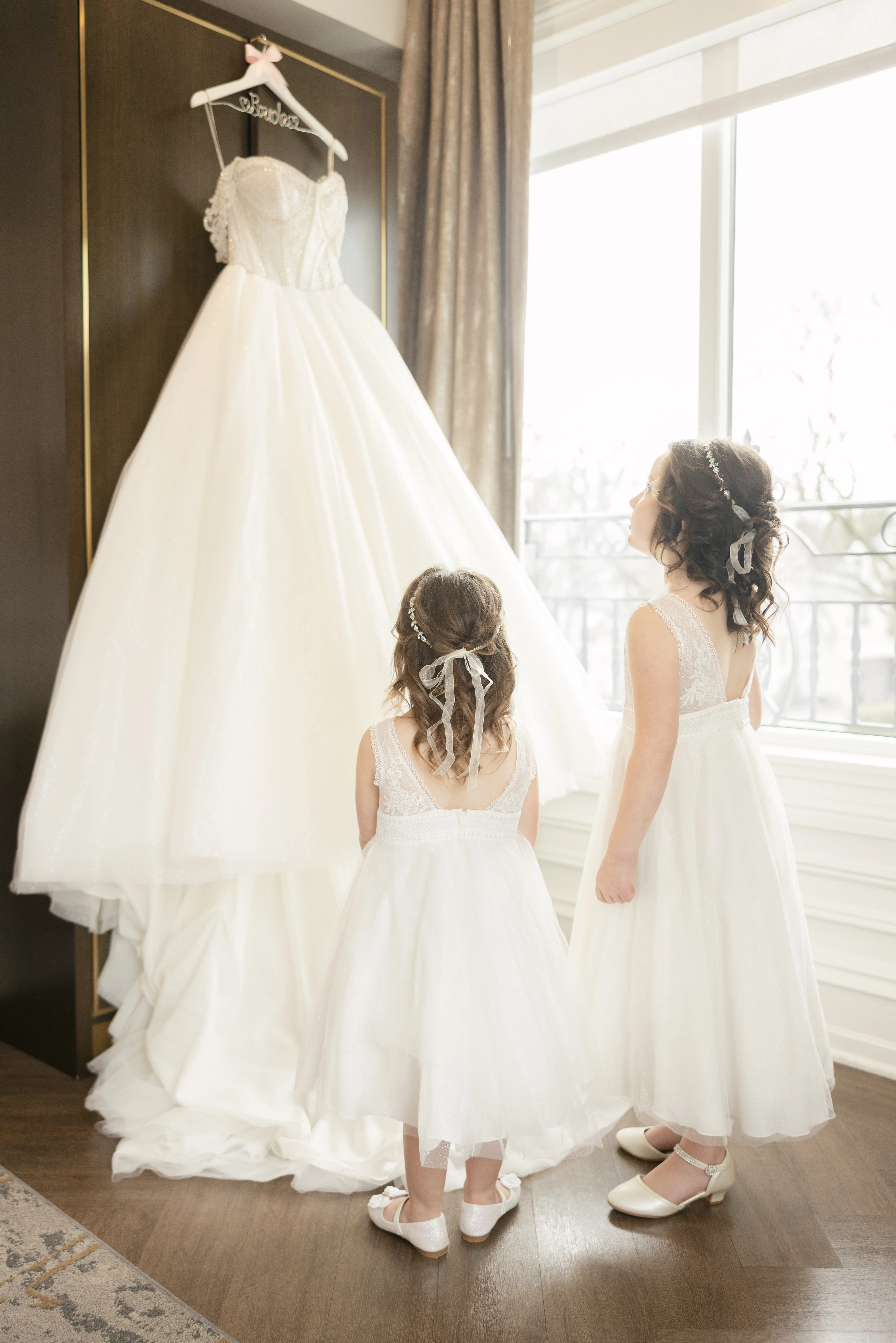 Flower Girls Looking At Princess Ballgown Called Elton By Sottero And Midgley
