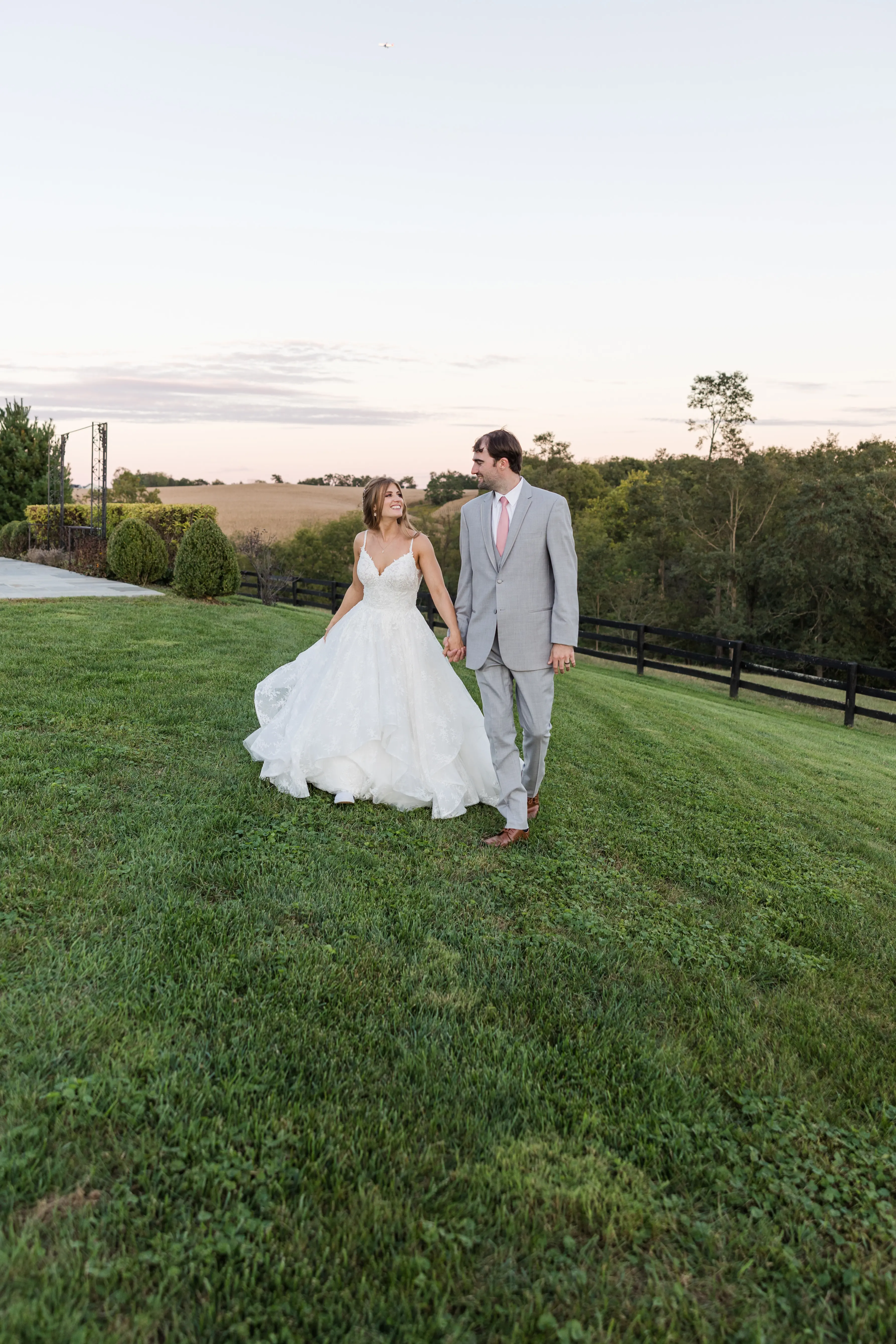 Groom with Bride in Modern Princess Wedding Dress with a Tiered Sequin Tulle Skirt Called Yuri by Maggie Sottero