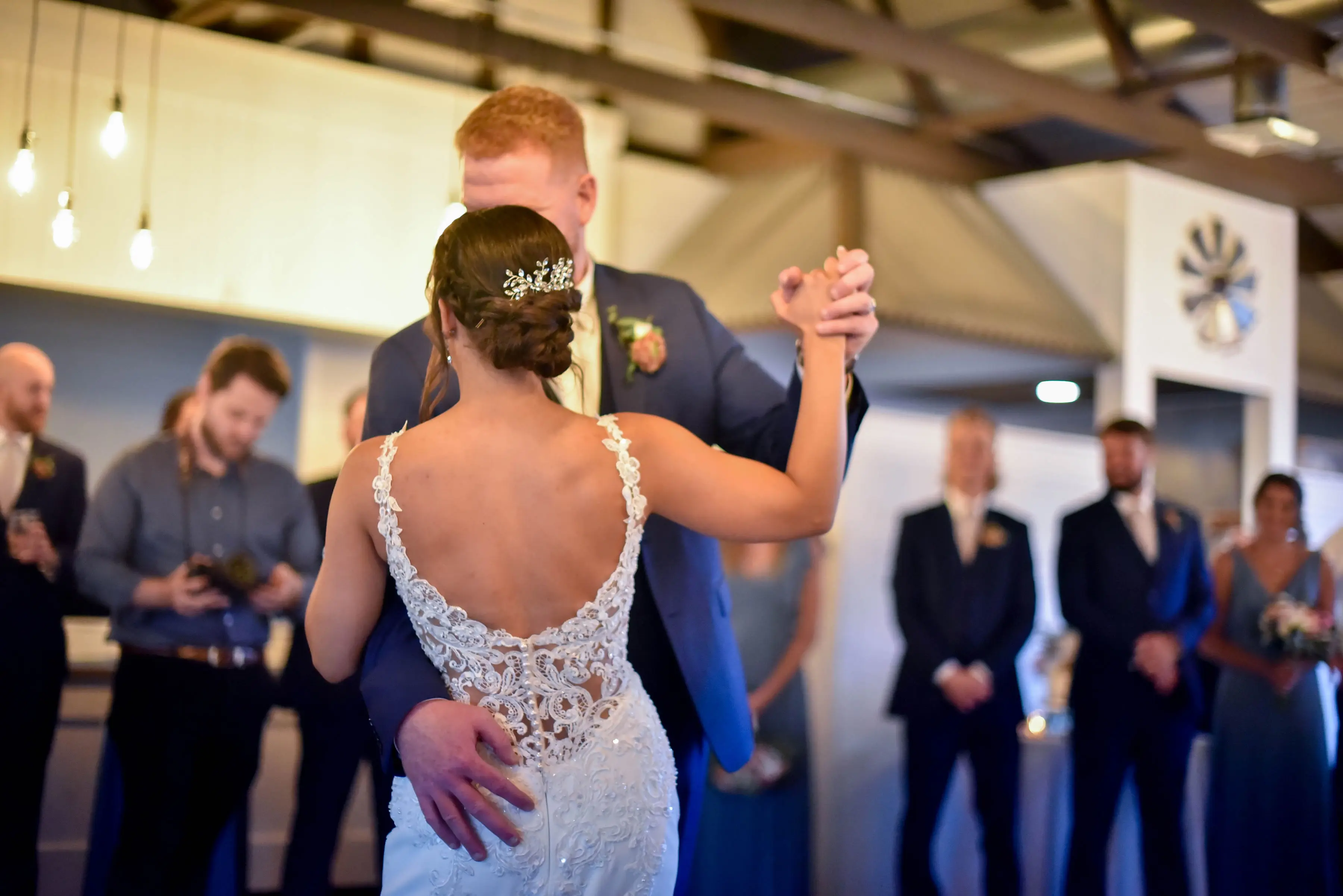 Bride with groom wearing crepe sheath wedding dress