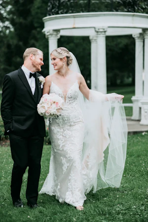 Bride and groom looking at each other smiling.