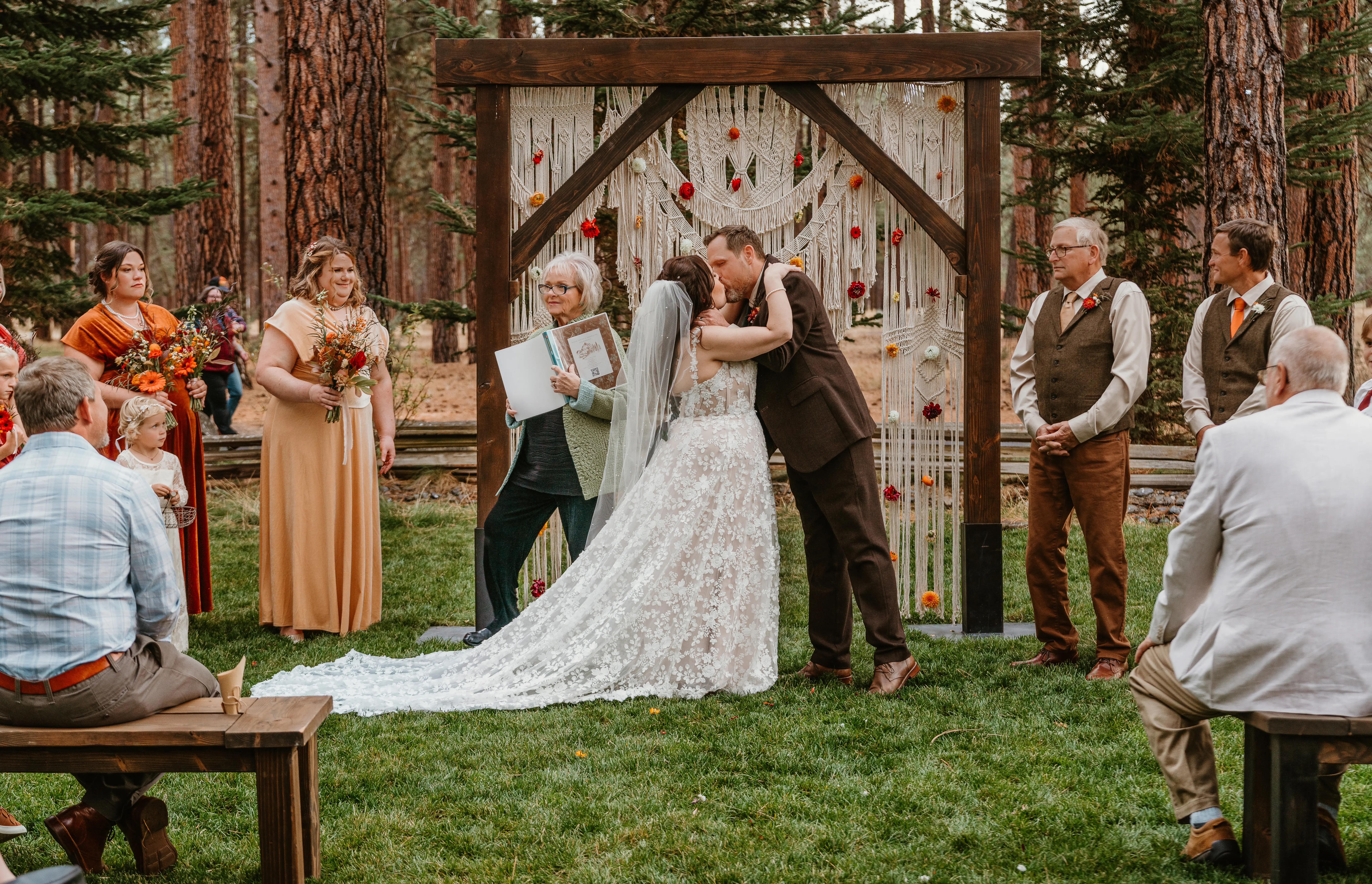 Bride Wearing Lace Wedding Dress Called Ladonna By Maggie Sottero Kissing Groom