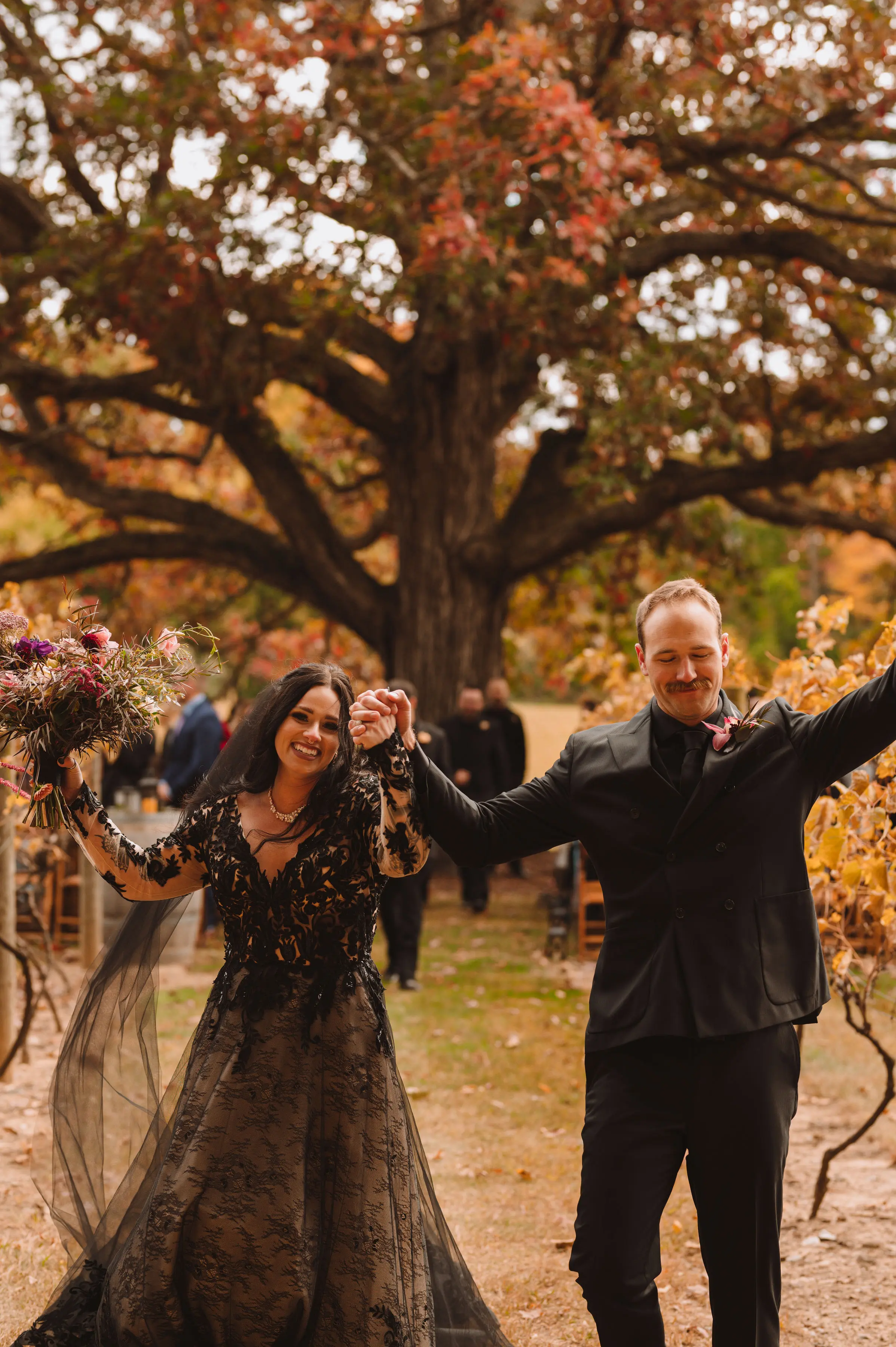 Bride Wearing Black Lace Wedding Dress Called Zander By Sottero And Midgley With Groom