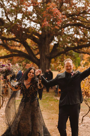 Bride Wearing Black Lace Wedding Dress Called Zander By Sottero And Midgley With Groom
