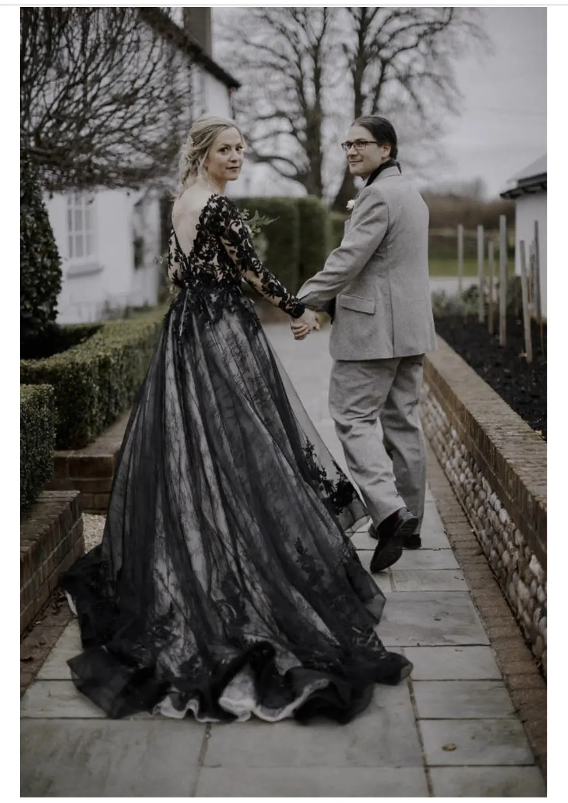 Bride Wearing Black Ballgown Wedding Gown Called Zander By Sottero and Midgley With The Groom