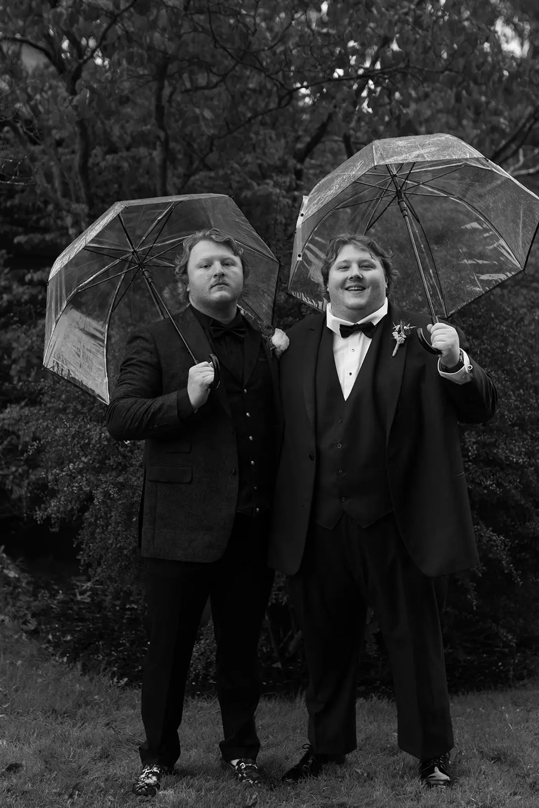 Groom And Groomsmen At Wedding With Umbrellas