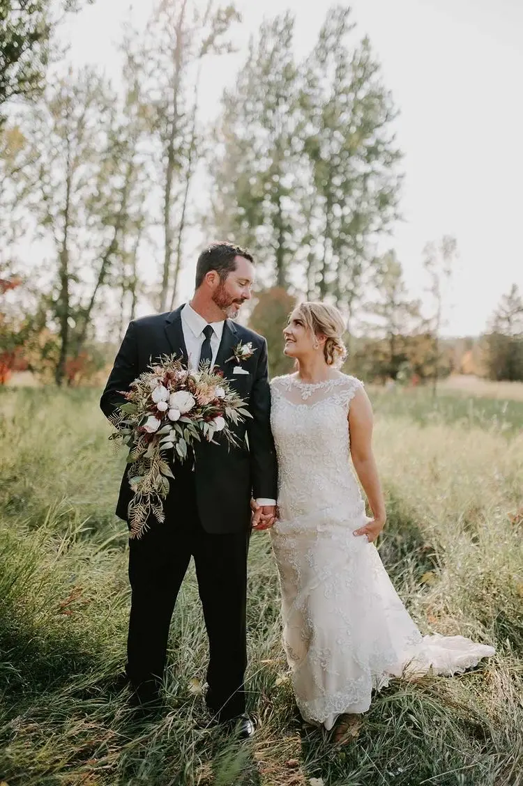 Groom With Bride Wearing Lace Wedding Dress With Illusion Back Verina Marie By Maggie Sottero