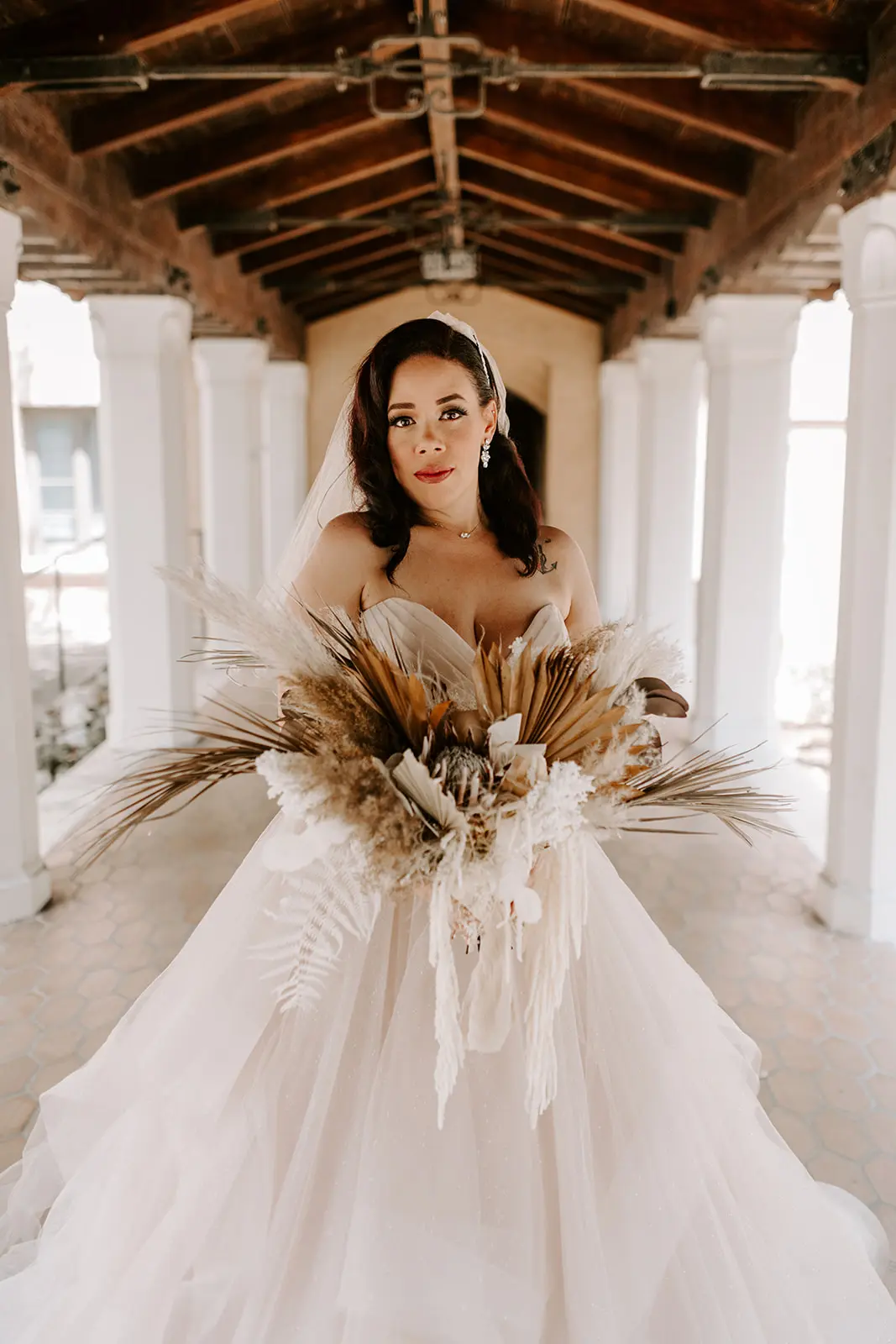 Bride wearing strapless tulle ballgown wedding dress