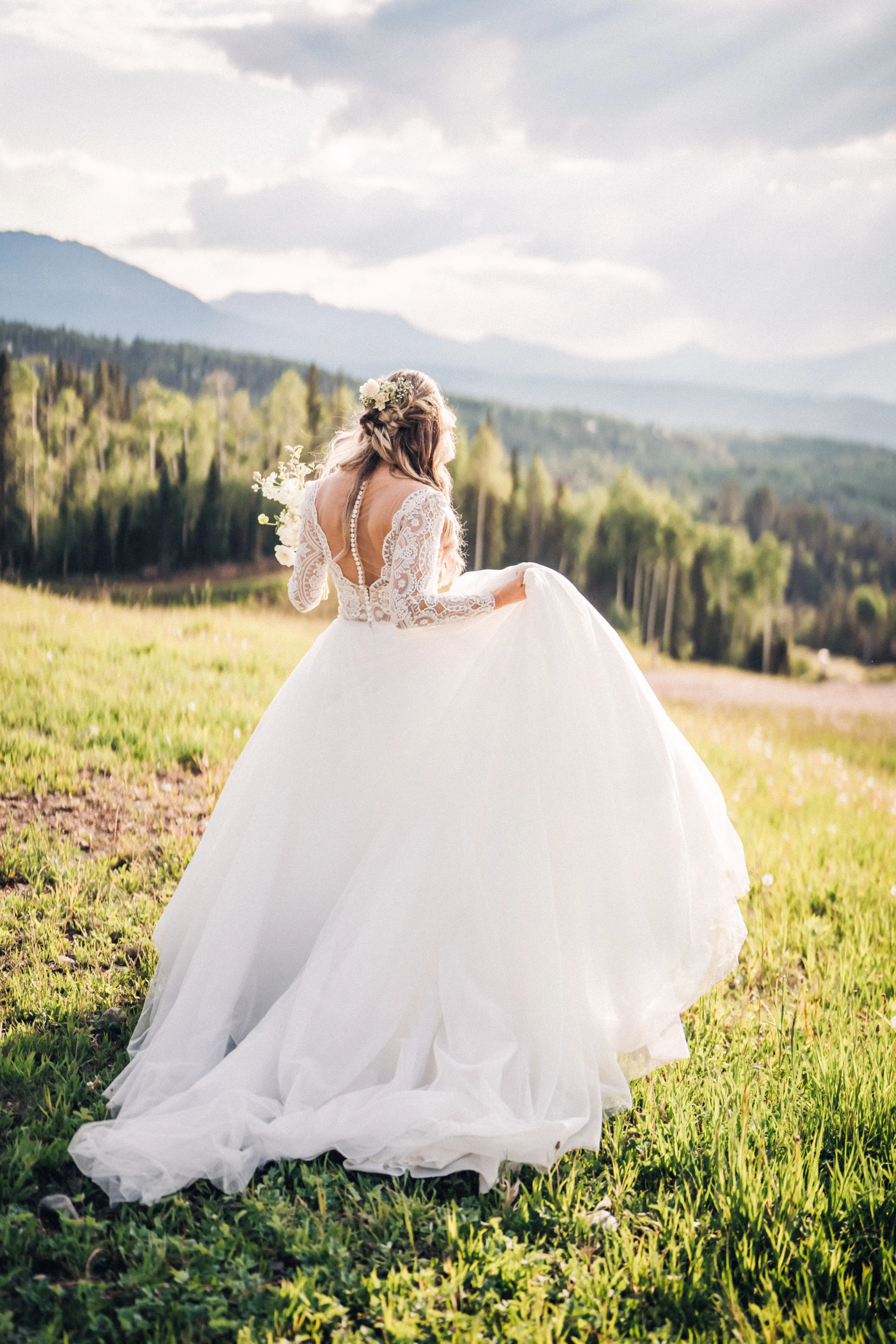 Bride wearing long sleeve lace ballgown wedding dress