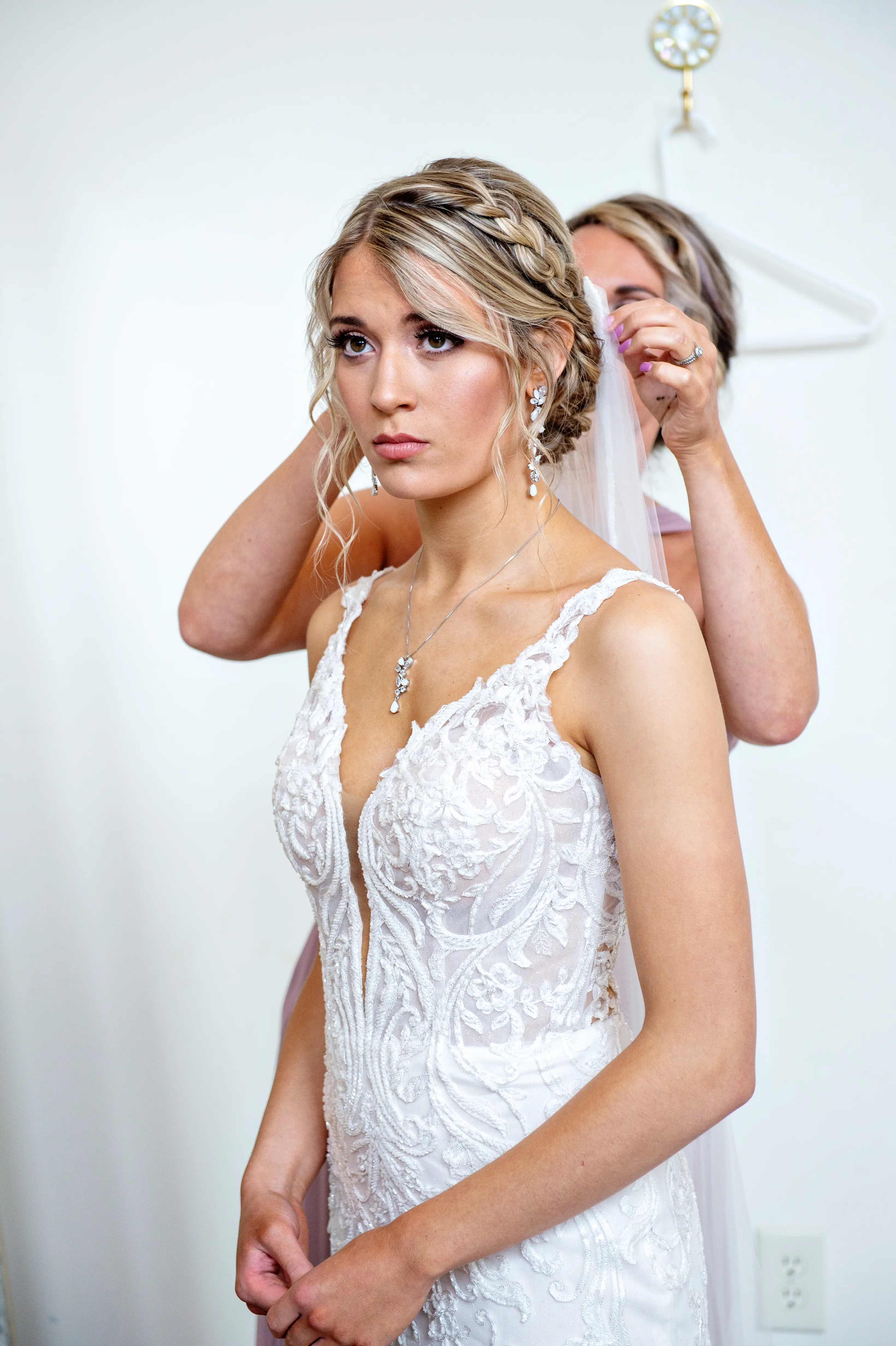 Bride in Elegant Lace Sheath Wedding Dress with Beaded Lace Motifs over Textured Tulle Called Hamilton by Sottero & Midgley