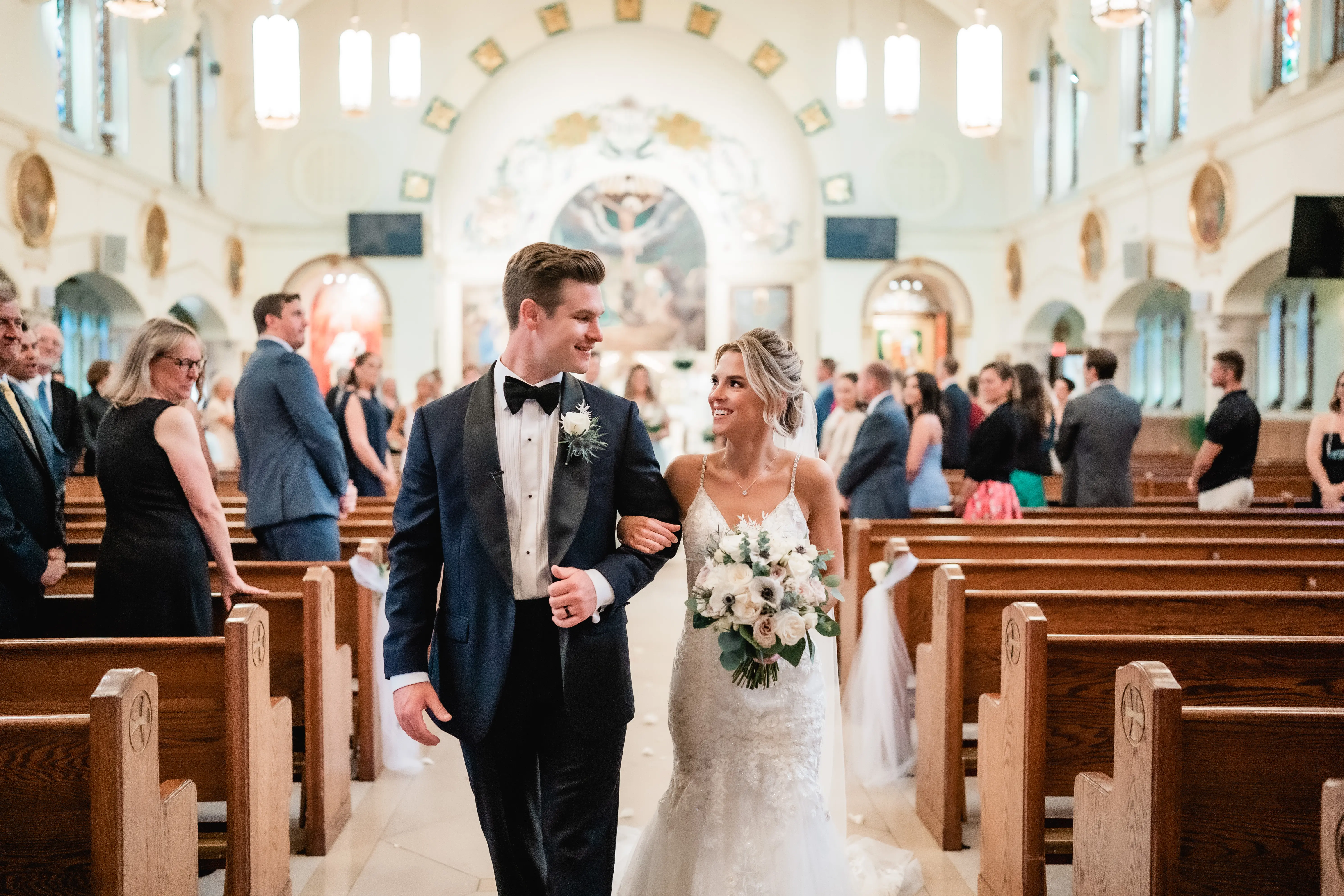 Bride and groom leaving the church after they have been wed.