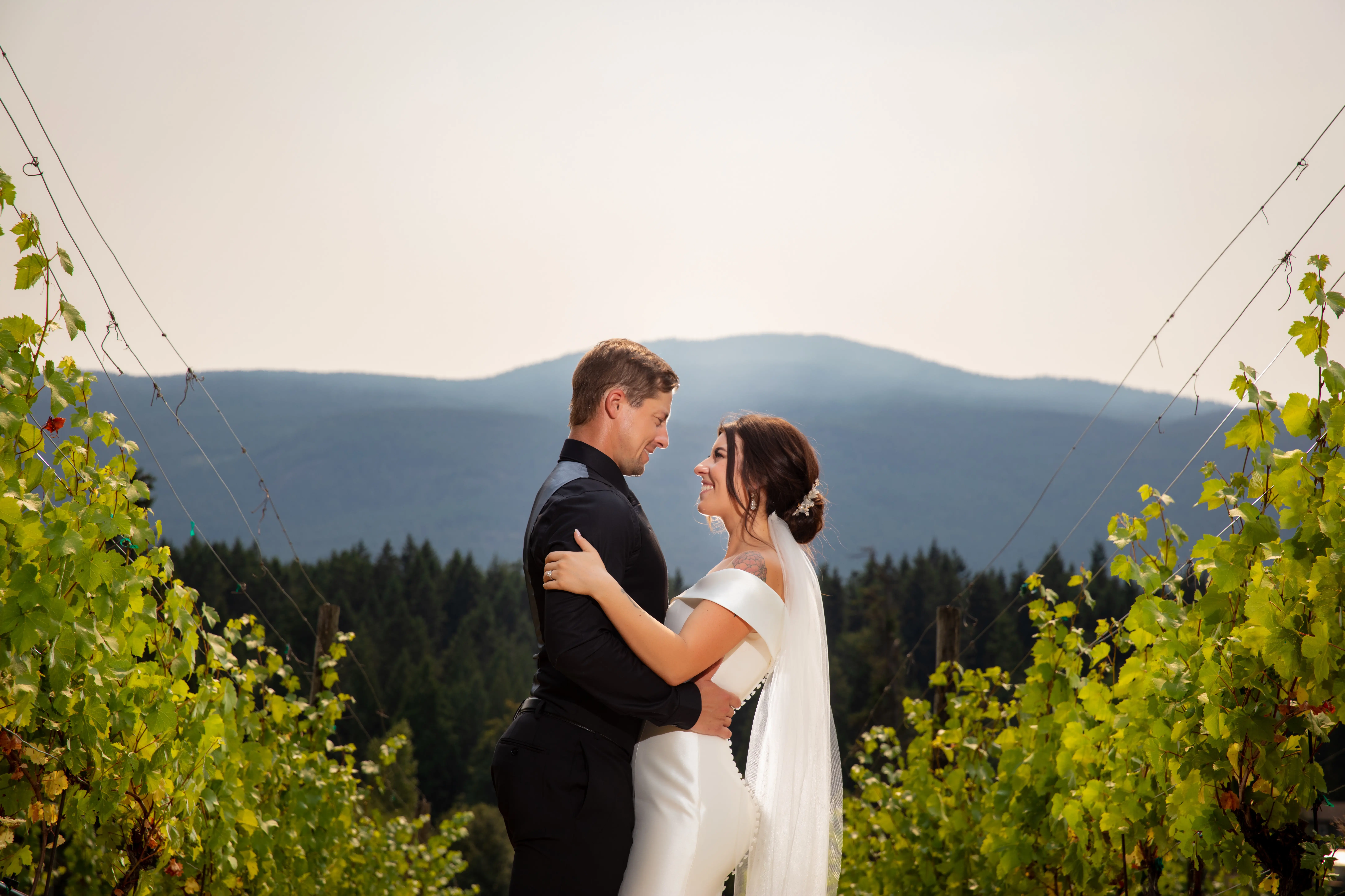 Bride Wearing Simple Classic Wedding Gown Called Josie By Rebecca Ingram With Groom