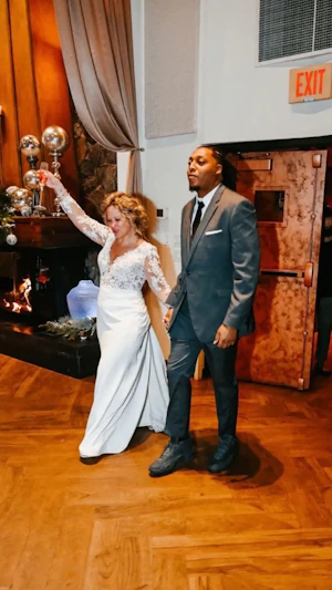 Groom With Bride Wearing Long Sleeve Sheath Wedding Dress Althea By Maggie Sottero