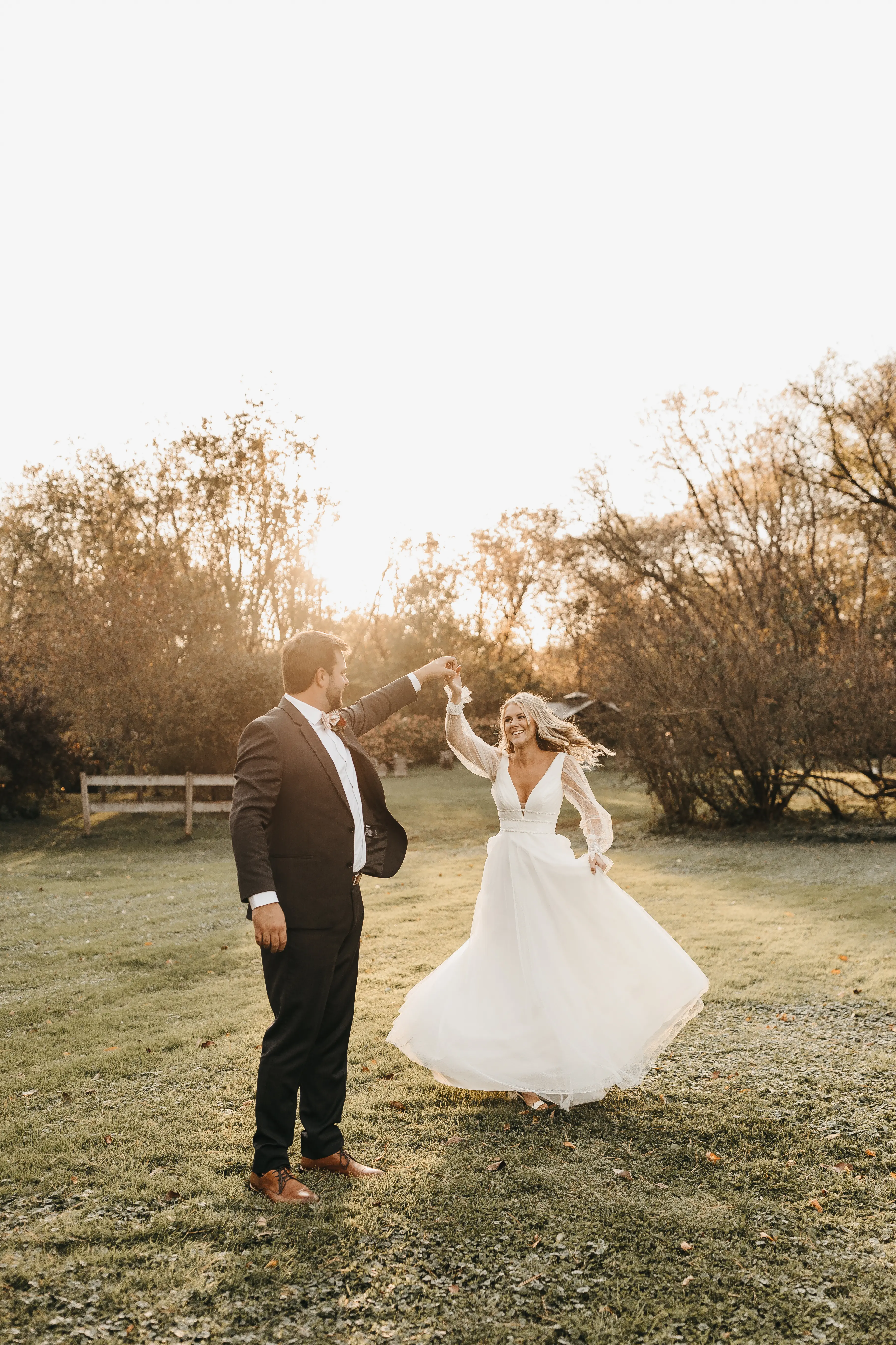 Bride with groom in long bishop sleeve, boho wedding dress