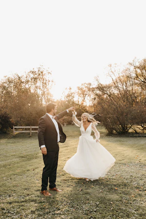 Bride with groom in long bishop sleeve, boho wedding dress