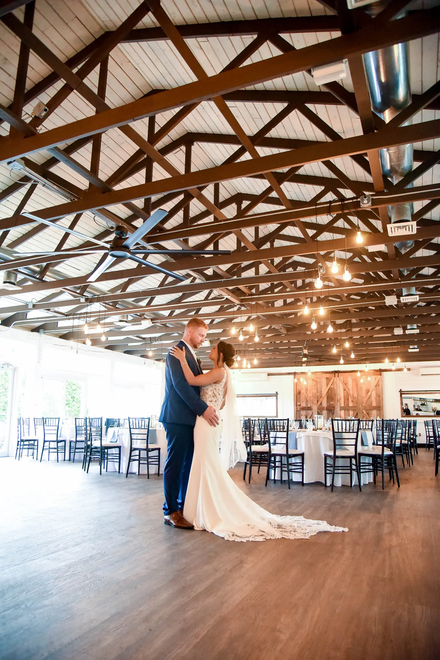 Bride with groom wearing crepe sheath wedding dress