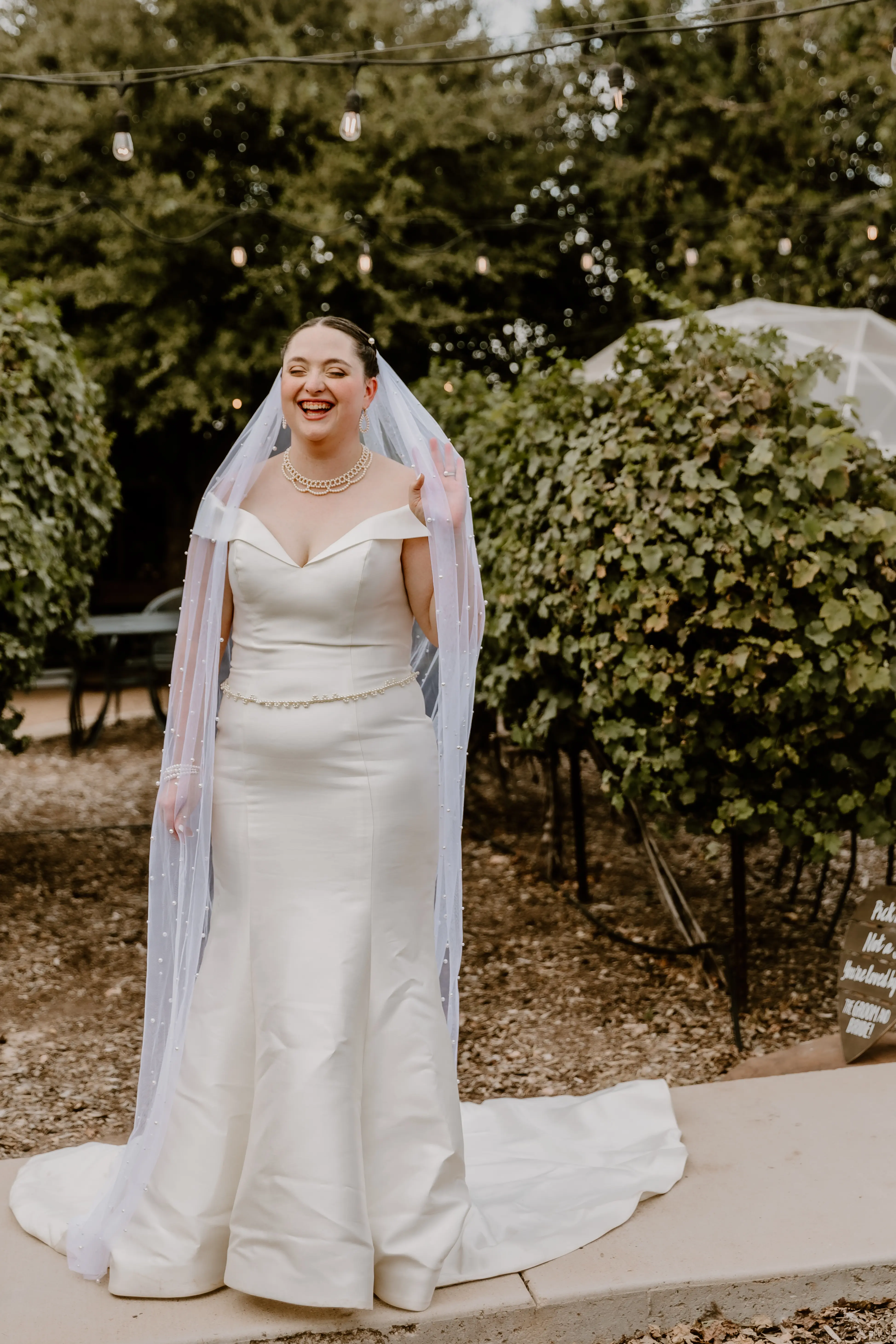 Bride Wearing Simple Fit And Flare Wedding Dress Called Josie By Rebecca Ingram Lauging