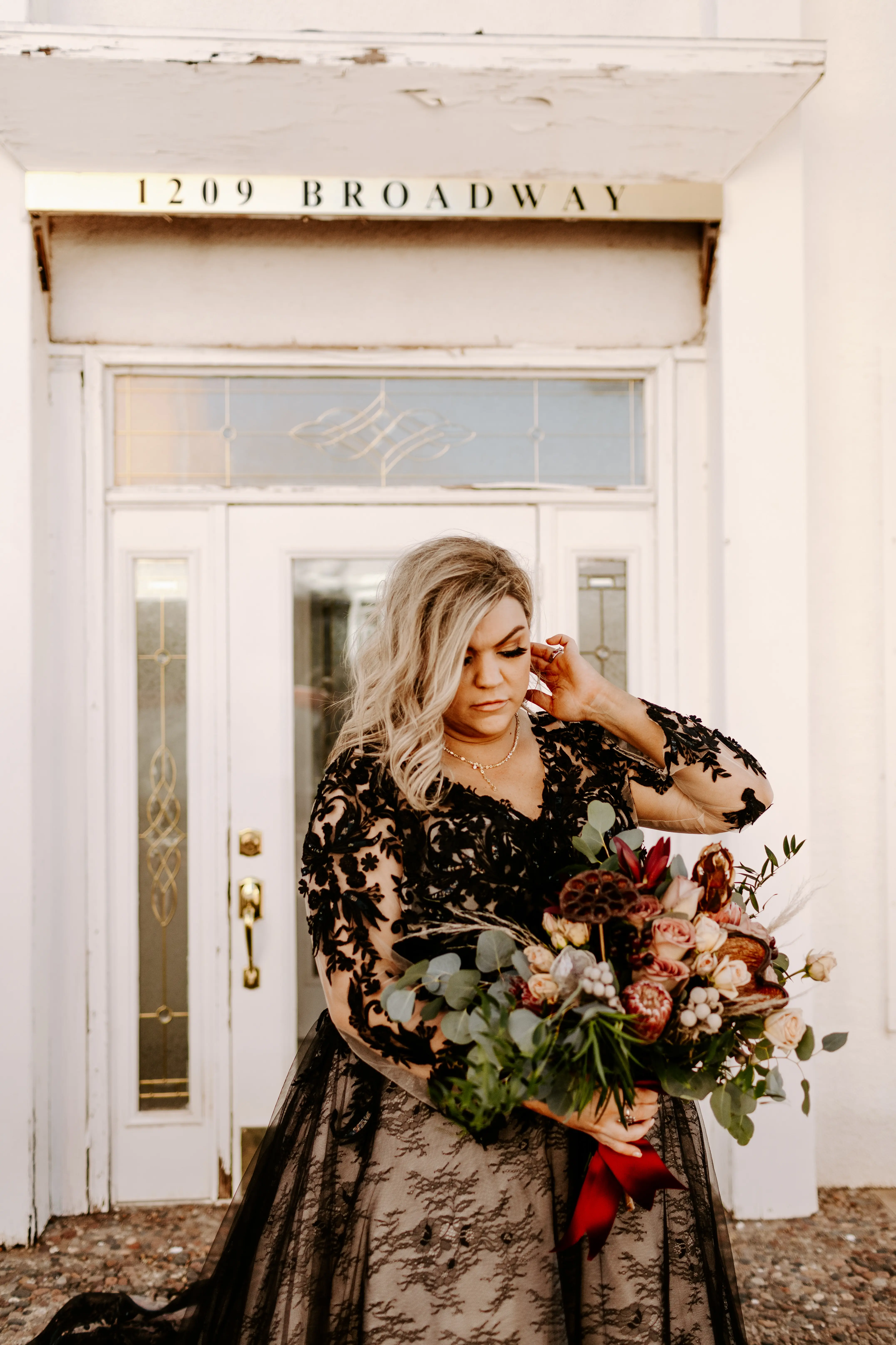 Bride Wearing Black Lace Wedding Dress Called Zander By Sottero And Midgley Holding Bouquet