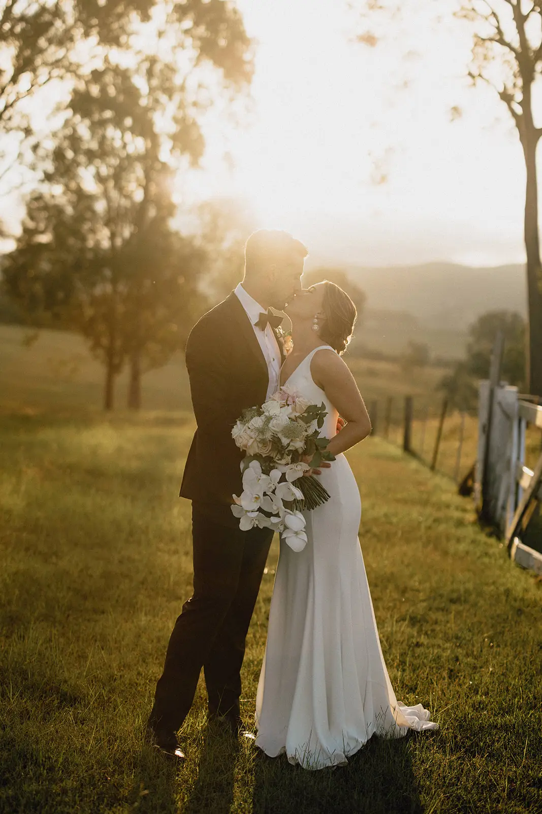 Groom With Bride Wearing Minimalist Crepe Fit-And-Flare Wedding Dress Fernanda By Maggie Sottero