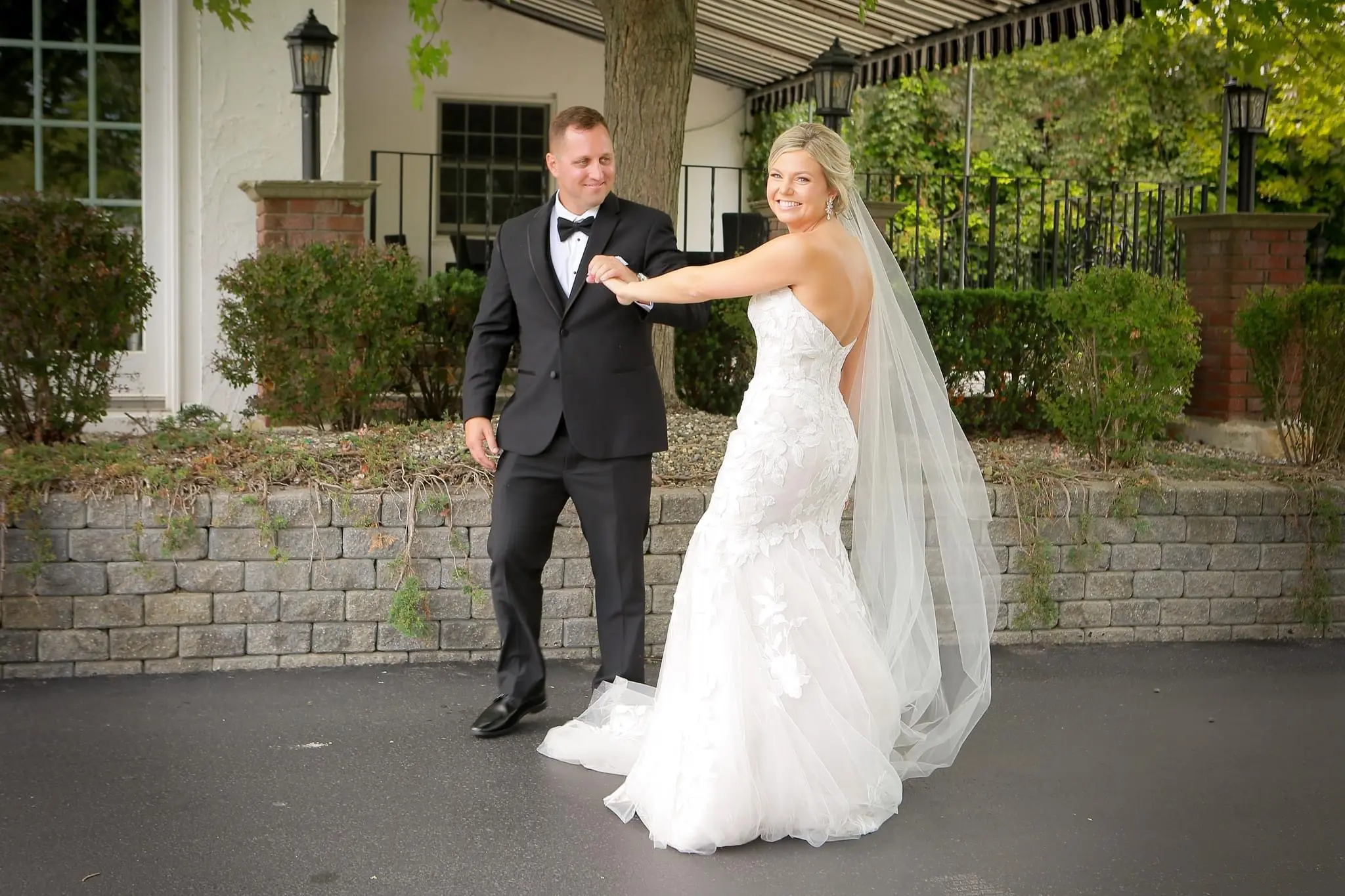 Groom With Bride Wearing Mermaid Wedding Dress With Oversized Floral Lace Hattie By Rebecca Ingram