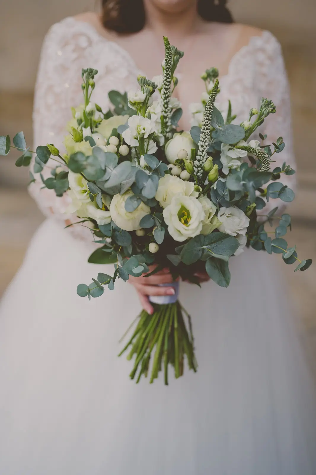 Bride Wearing Dreamy Long Sleeve Ballgown Wedding Dress Called Mallory Dawn By Maggie Sottero Holding Large Floral Bouquet