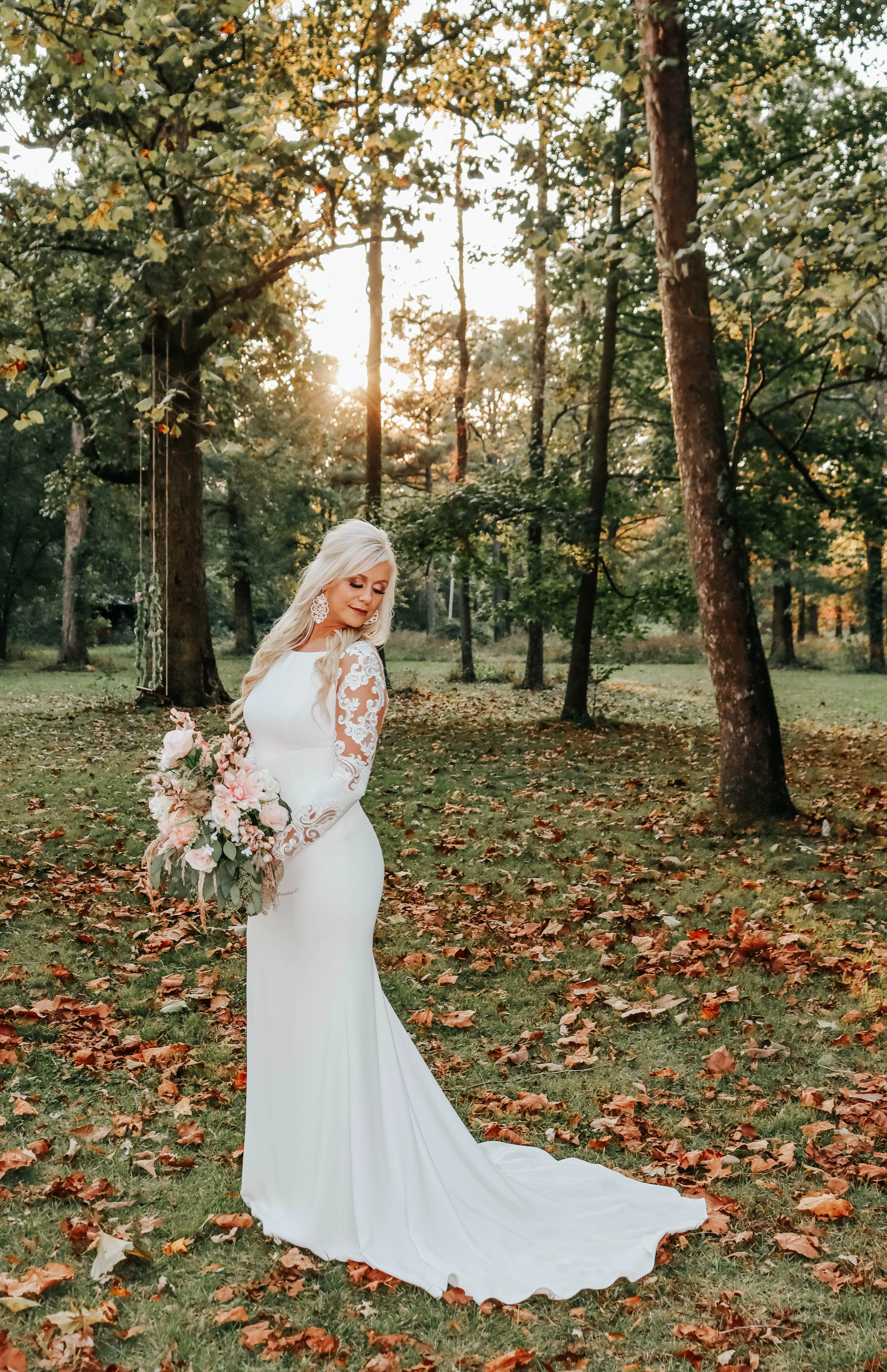 Bride wearing minimalist crepe long sleeve lace sheath wedding dress.
