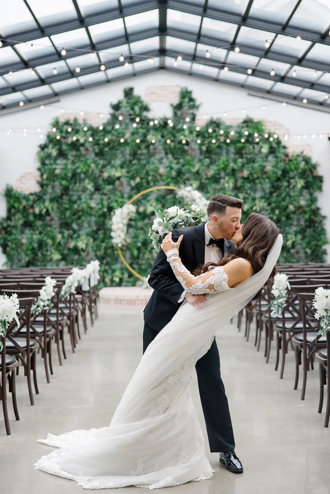 Bride And Groom First Kiss With Bride Wearing Sparkly Lace Wedding Dress Called Fiona By Maggie Sottero