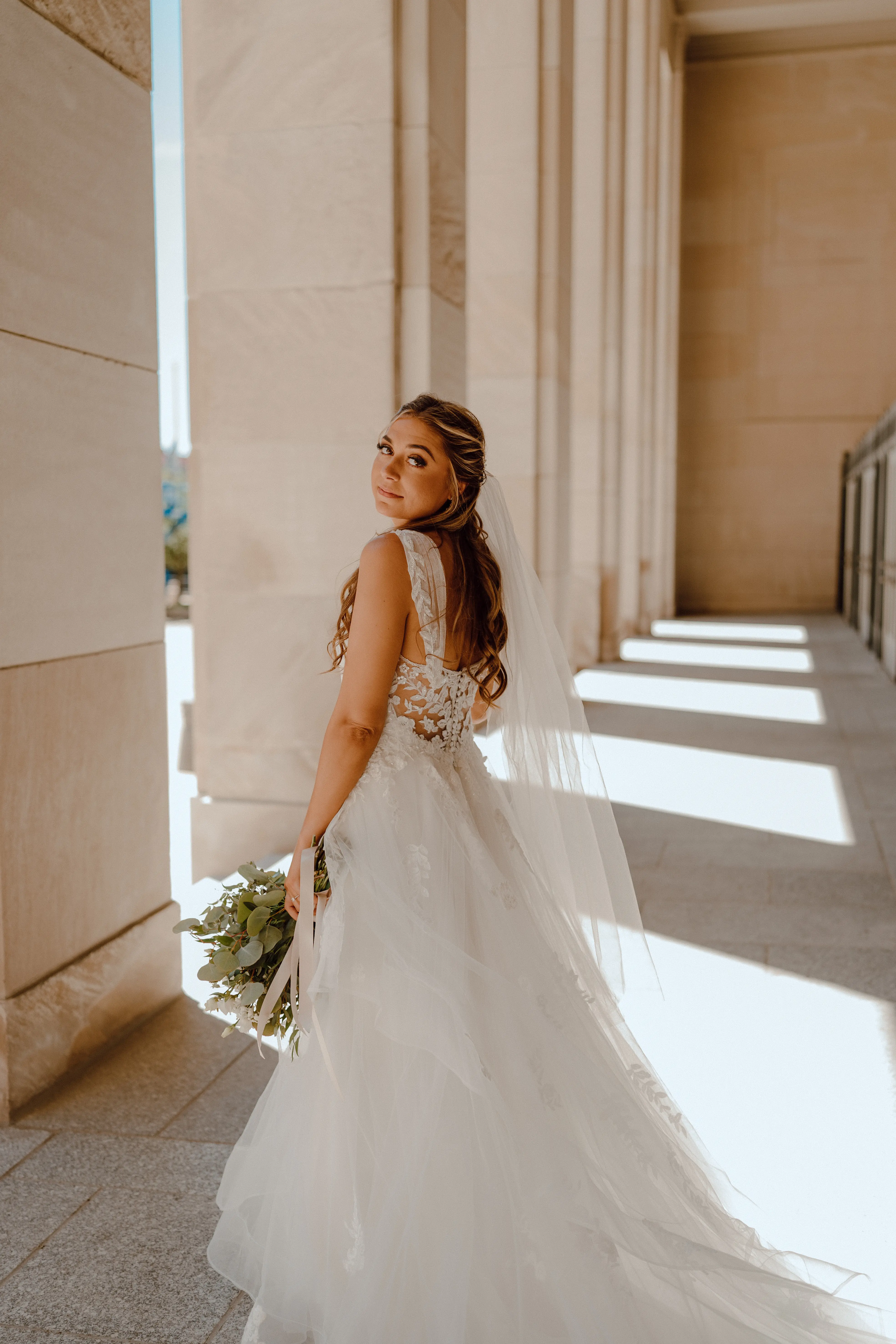 Bride in ruffle dress with illusion bodice called Lettie by Rebecca Ingram