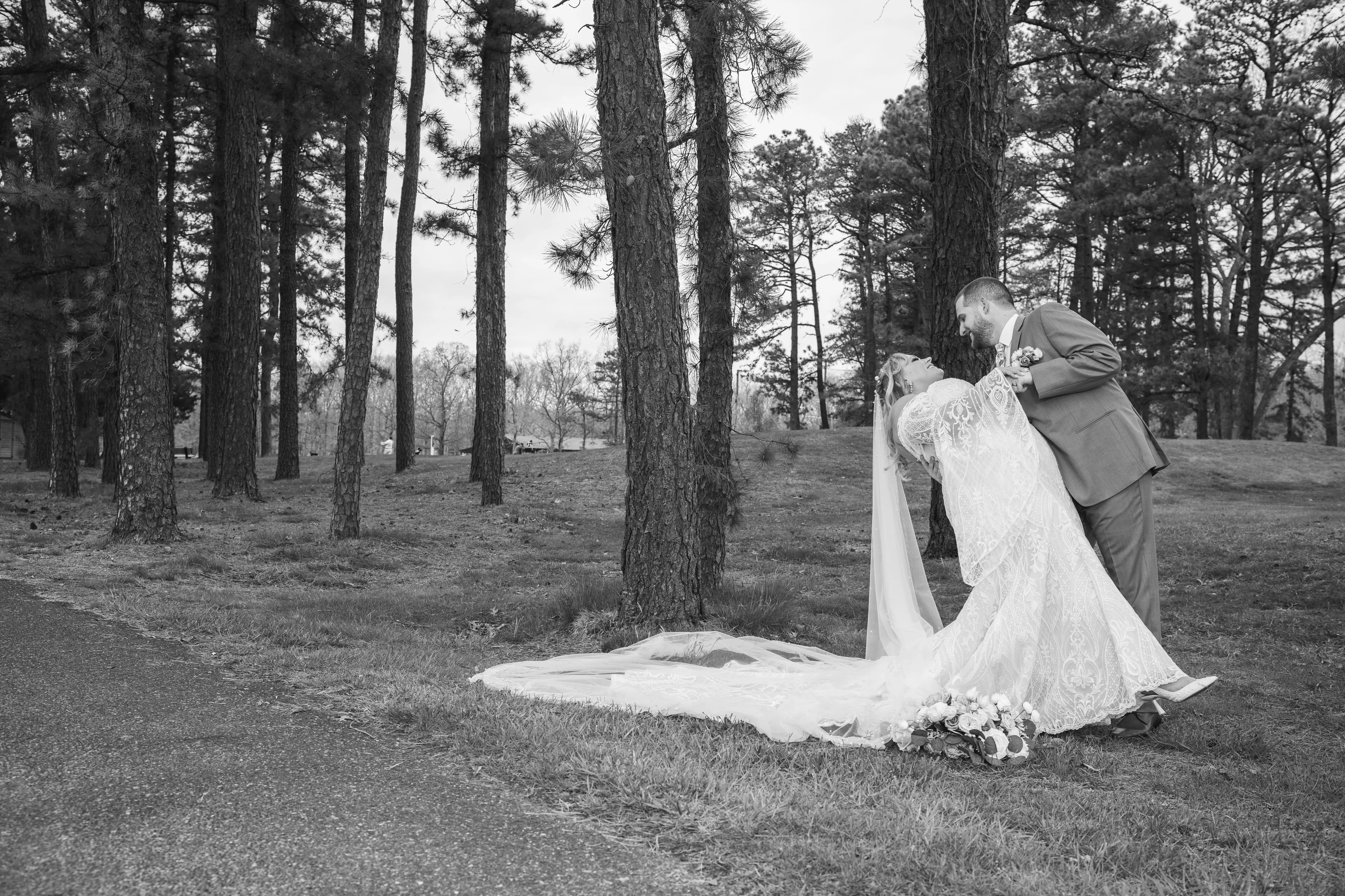 Bride wearing Bronson by Sottero and Midgley being dipped by her husband
