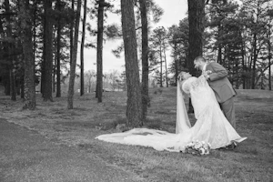 Bride wearing Bronson by Sottero and Midgley being dipped by her husband