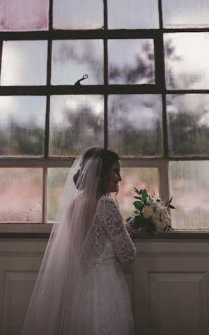 Bride Wearing Long Sleeve Lace Form Fitting Wedding Dress Tina Dawn By Rebecca Ingram