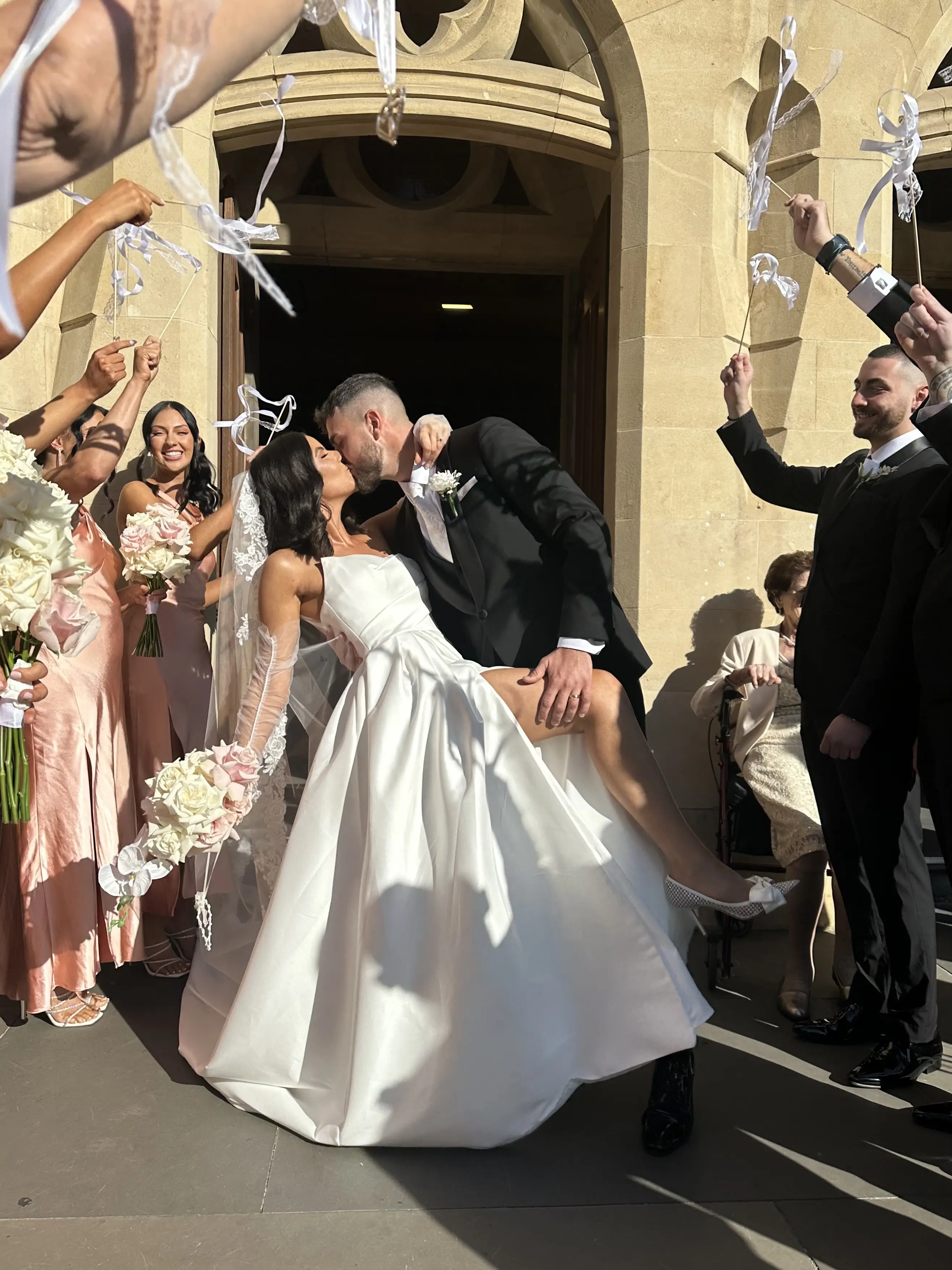 Bride wearing Aspen by Sottero and Midgley and her husband during their exit